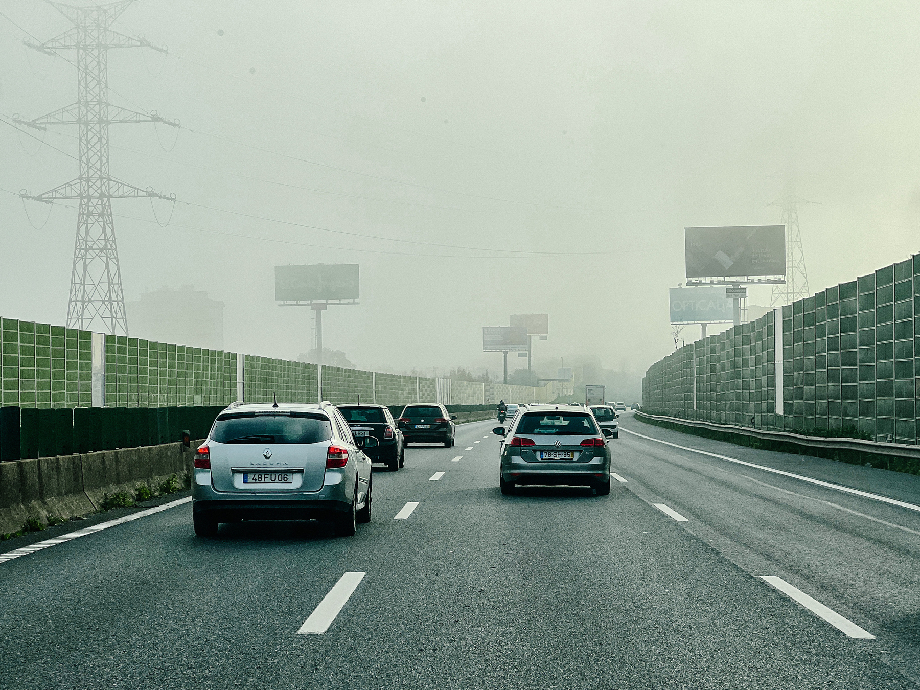 Cars on the highway, cloudy day. 