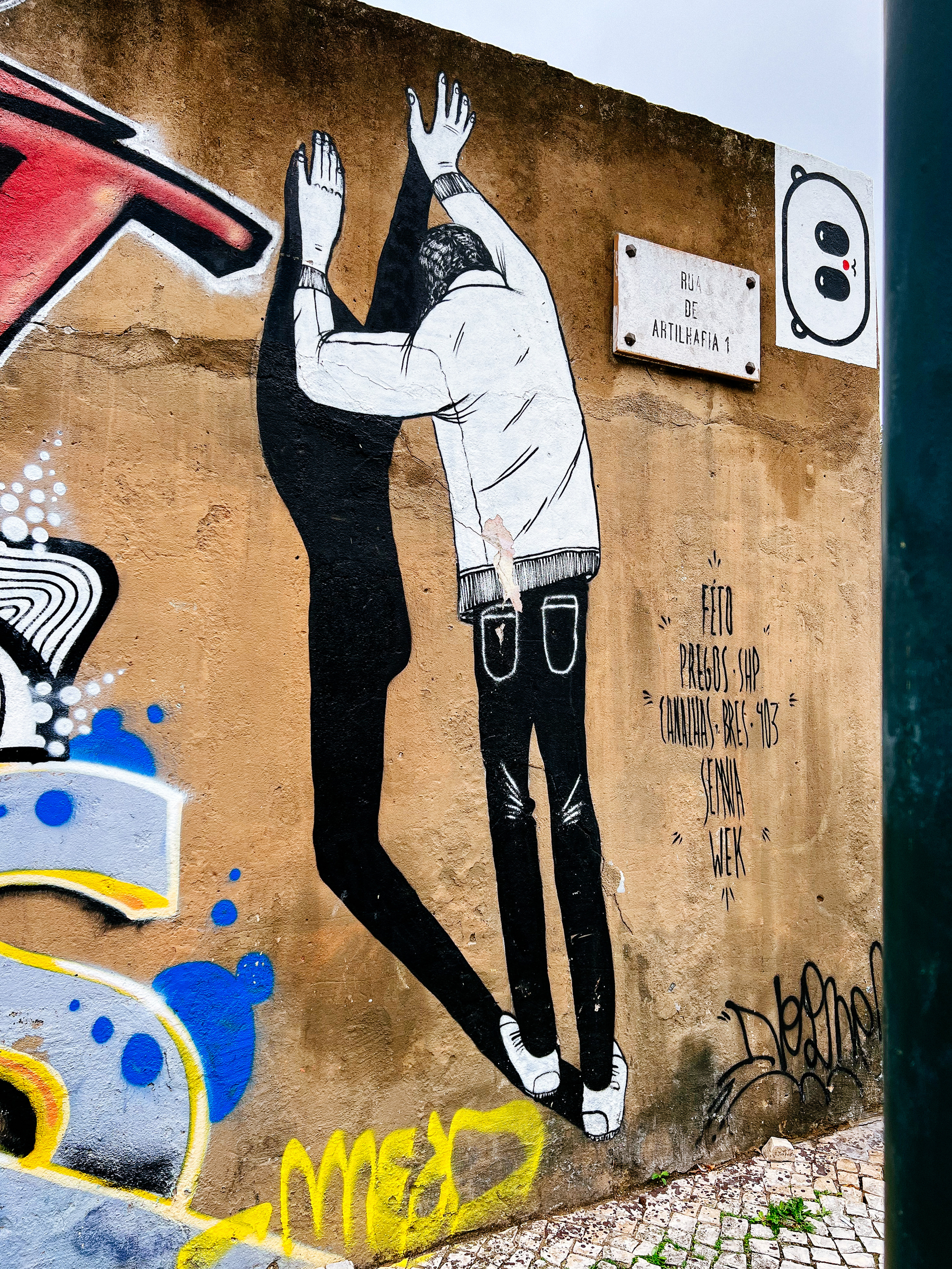 Street art, a man leaning against a wall