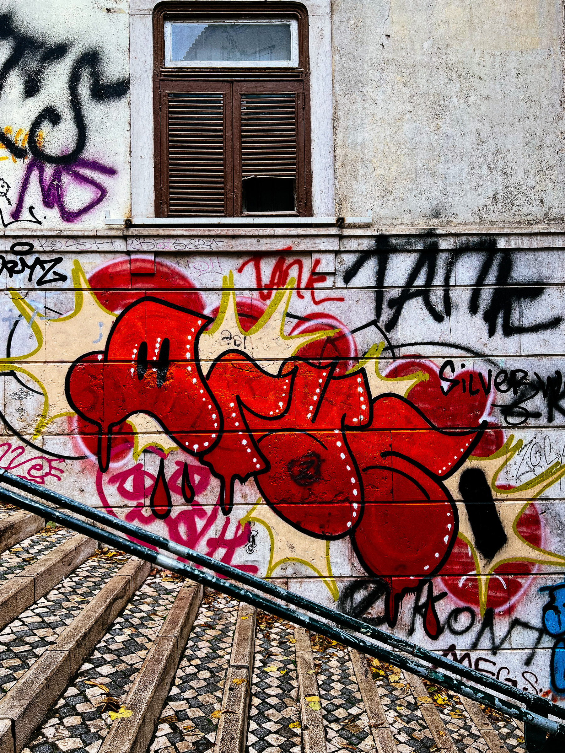 Graffiti, a tag, on a wall. 