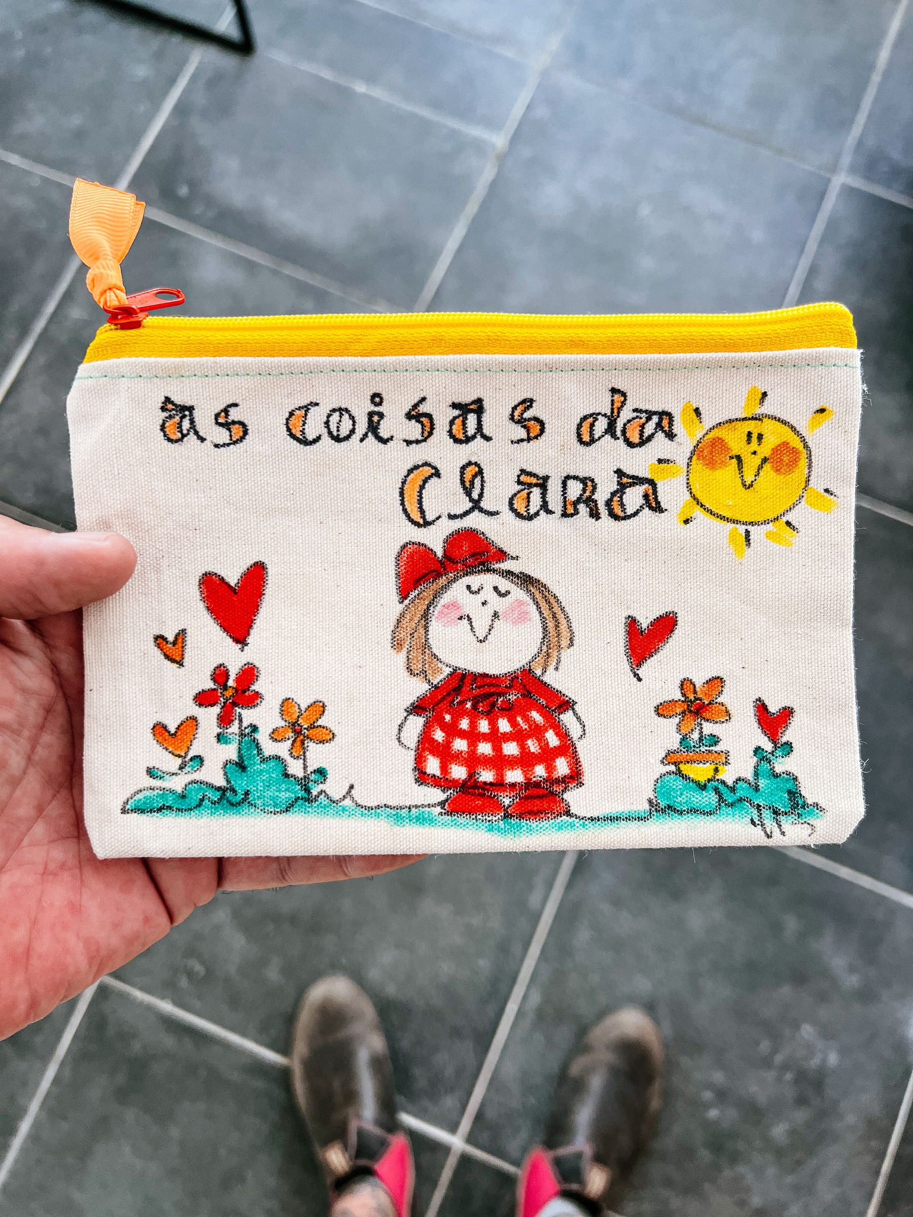 a purse with “Clara’s things” written on it