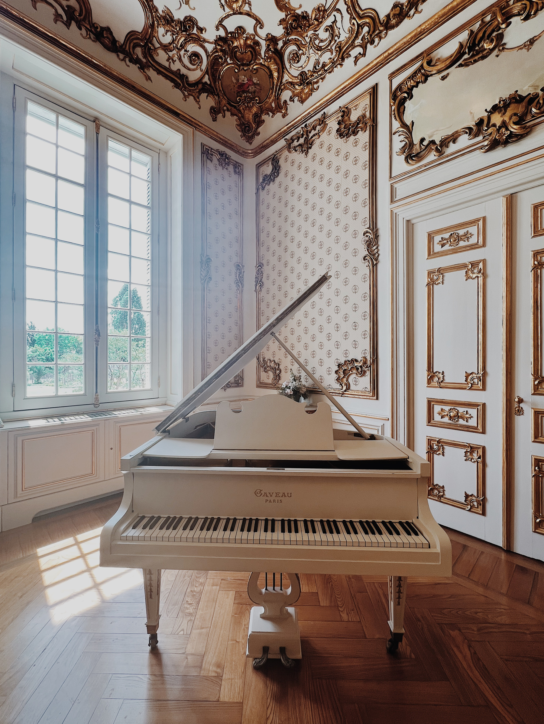 A vintage piano in a lavish room. 