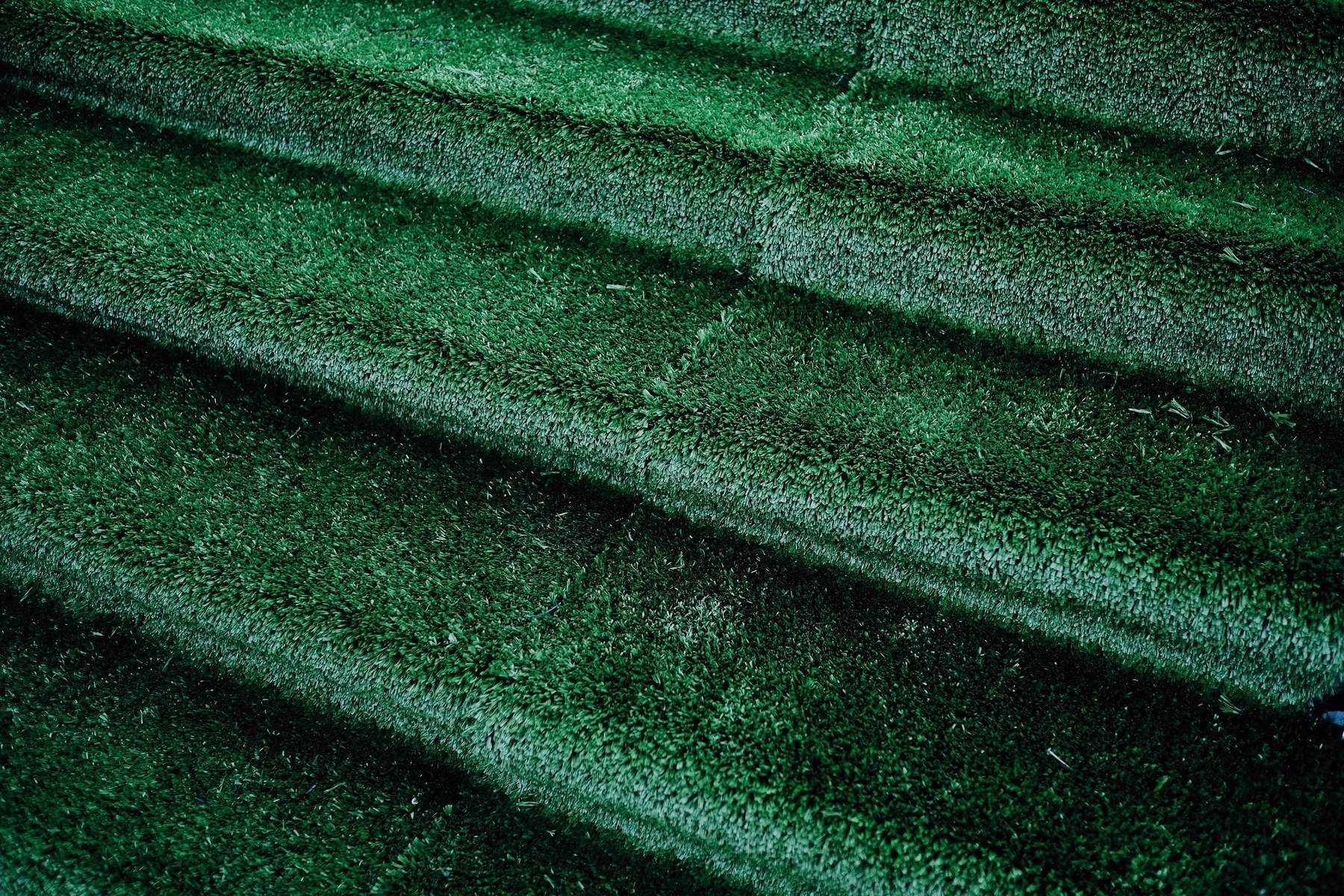 Stairway covered in fake grass.