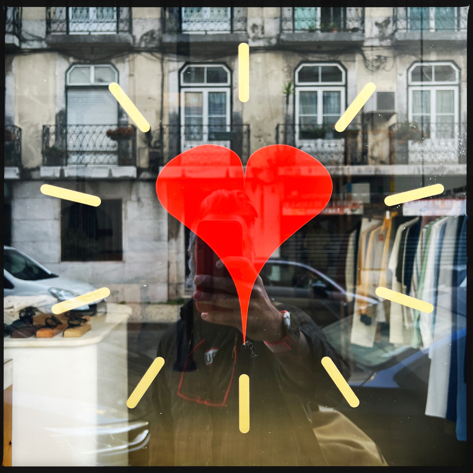 A heart sticker on a shop window. 