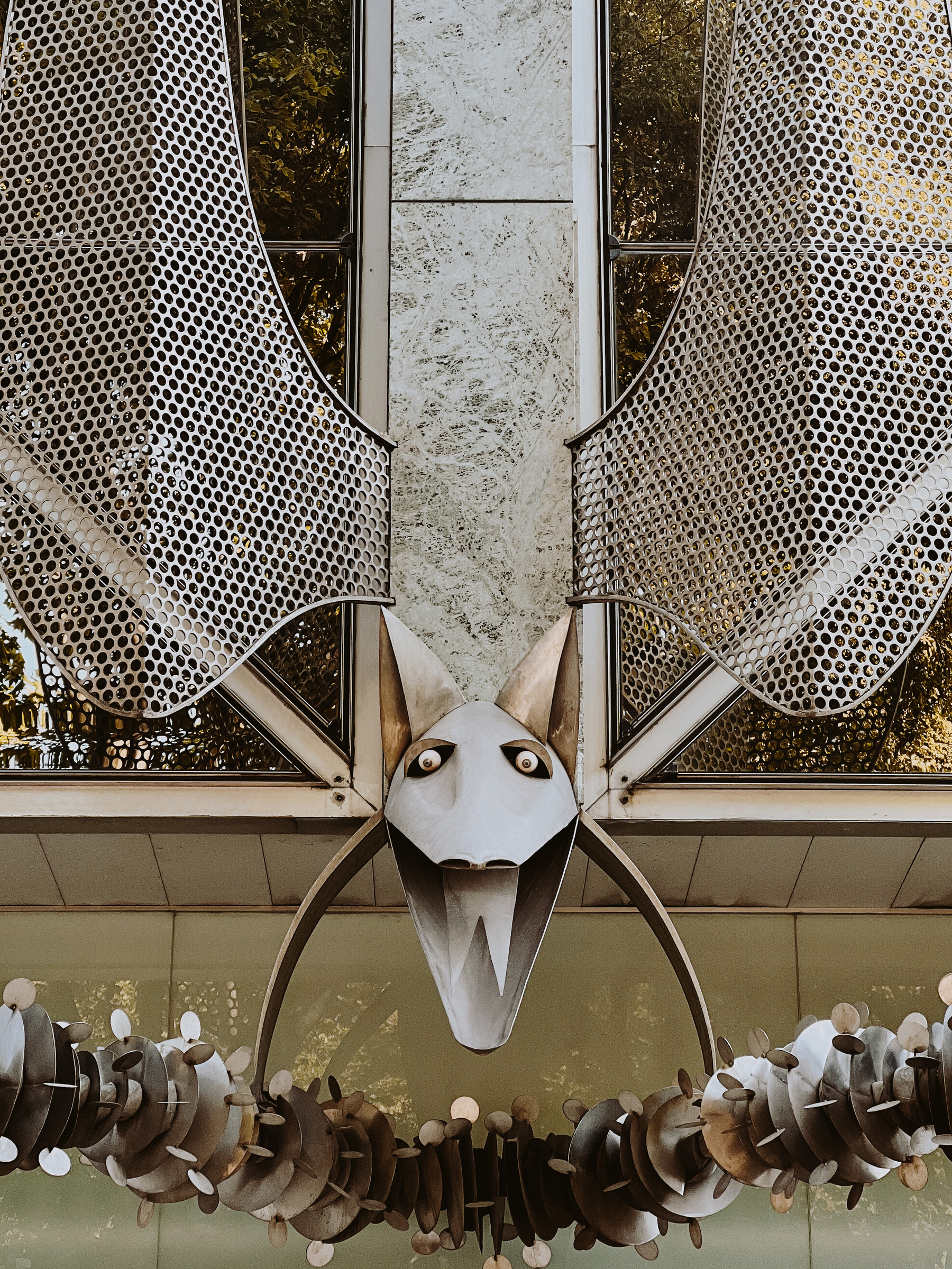 A modern take on a gargoyle, made out of metal. 