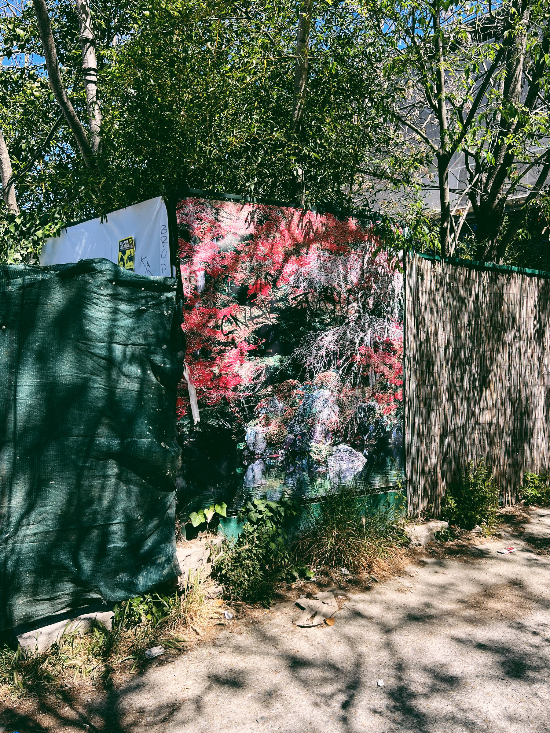a fence with a faded tarp.