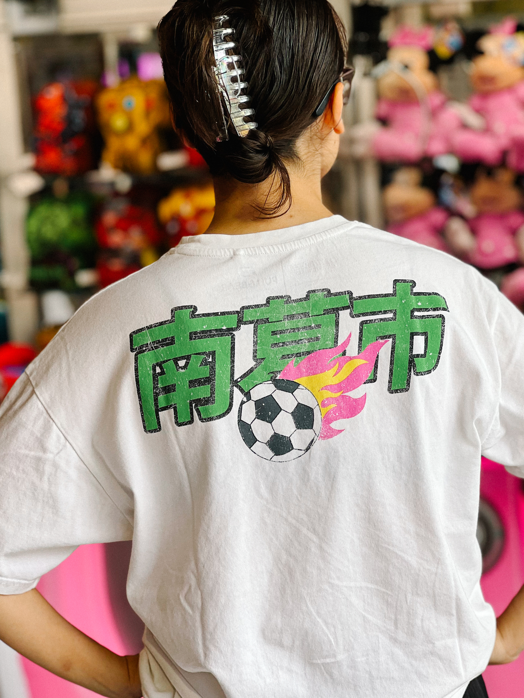 A girl with a Japanese t-shirt. 