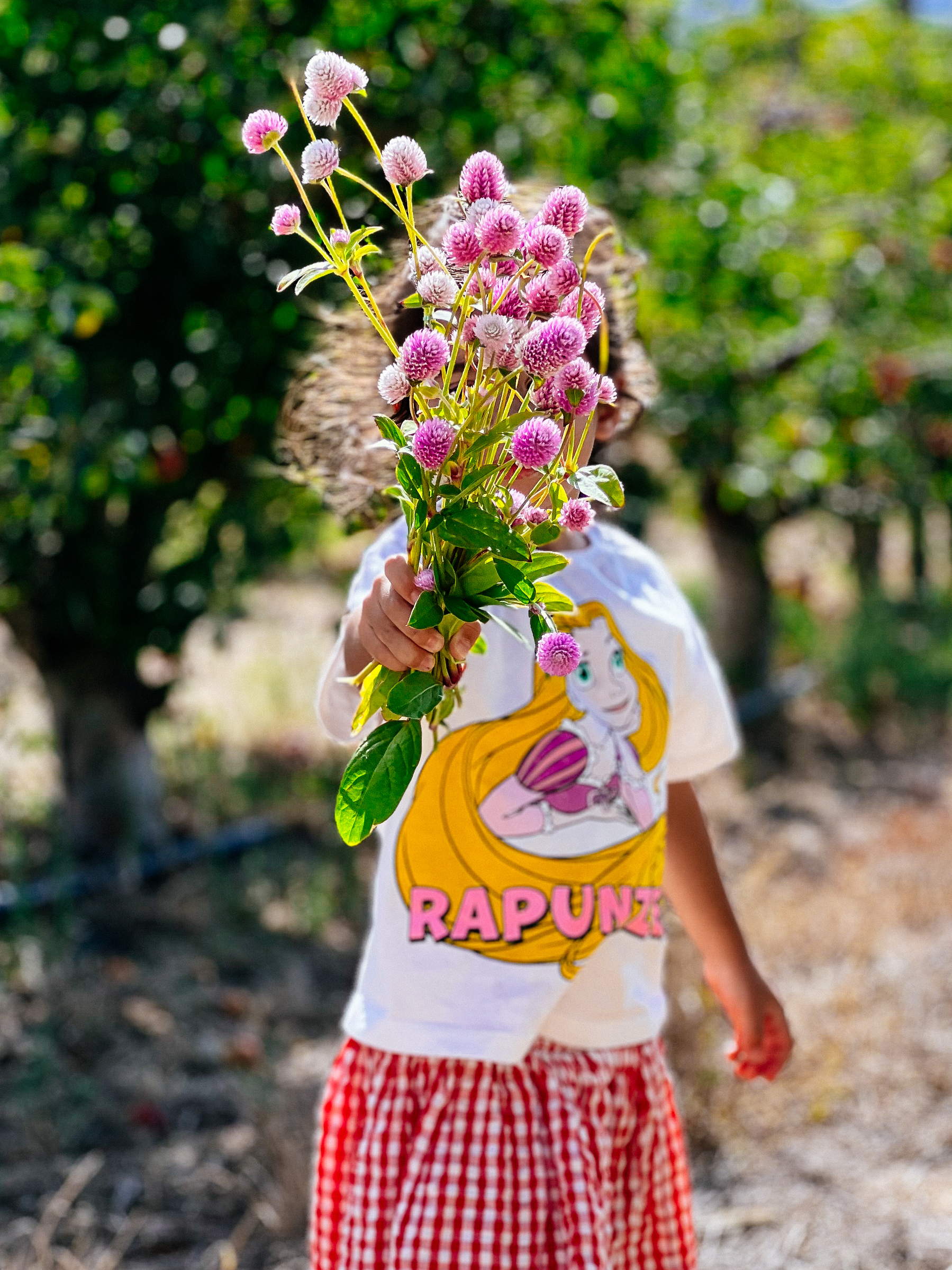 A girl holding flowers. 