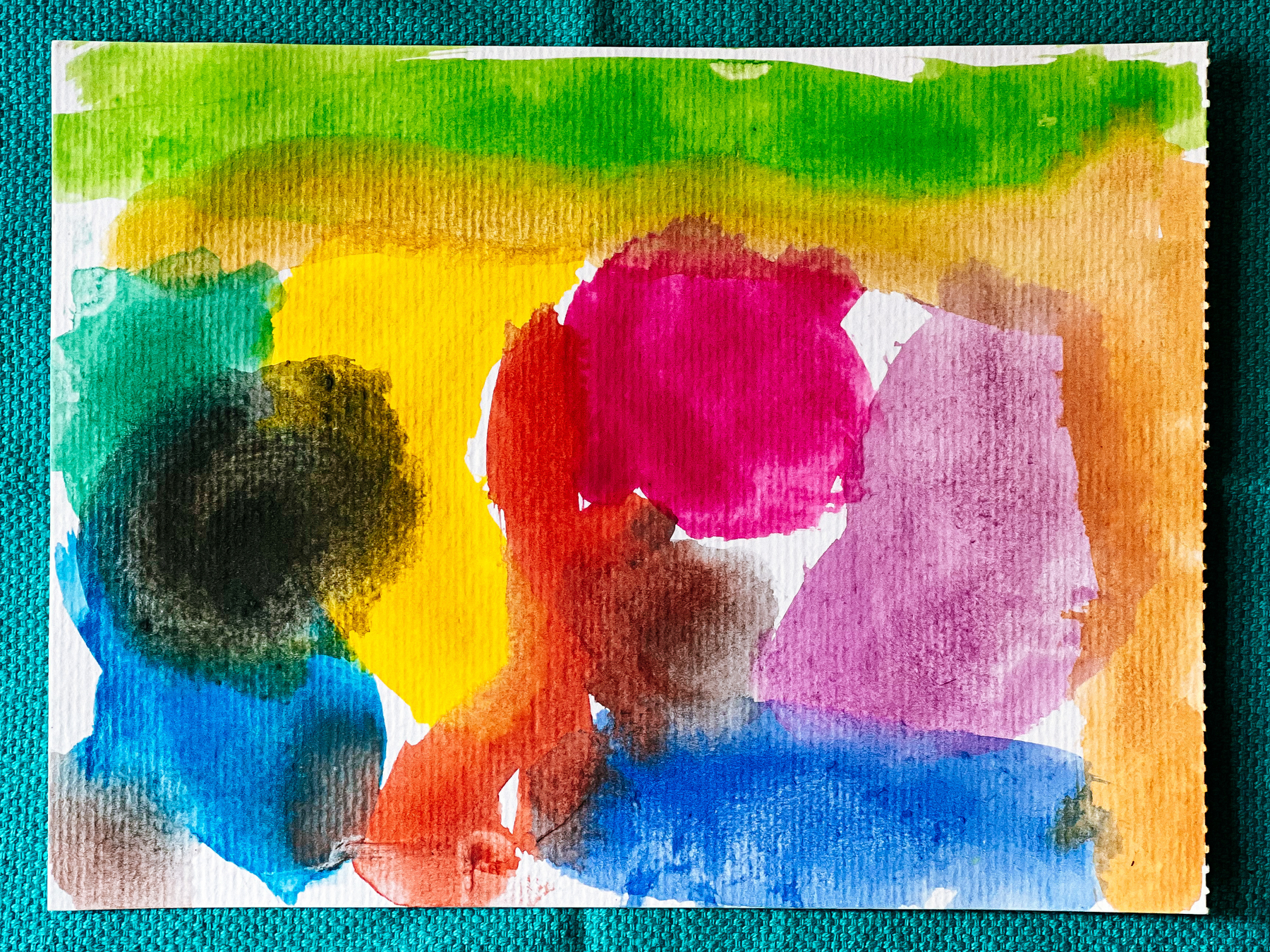 A beautiful art piece, watercolor on paper. Pink, red, blue, yellow, green, black, and orange blobs. 