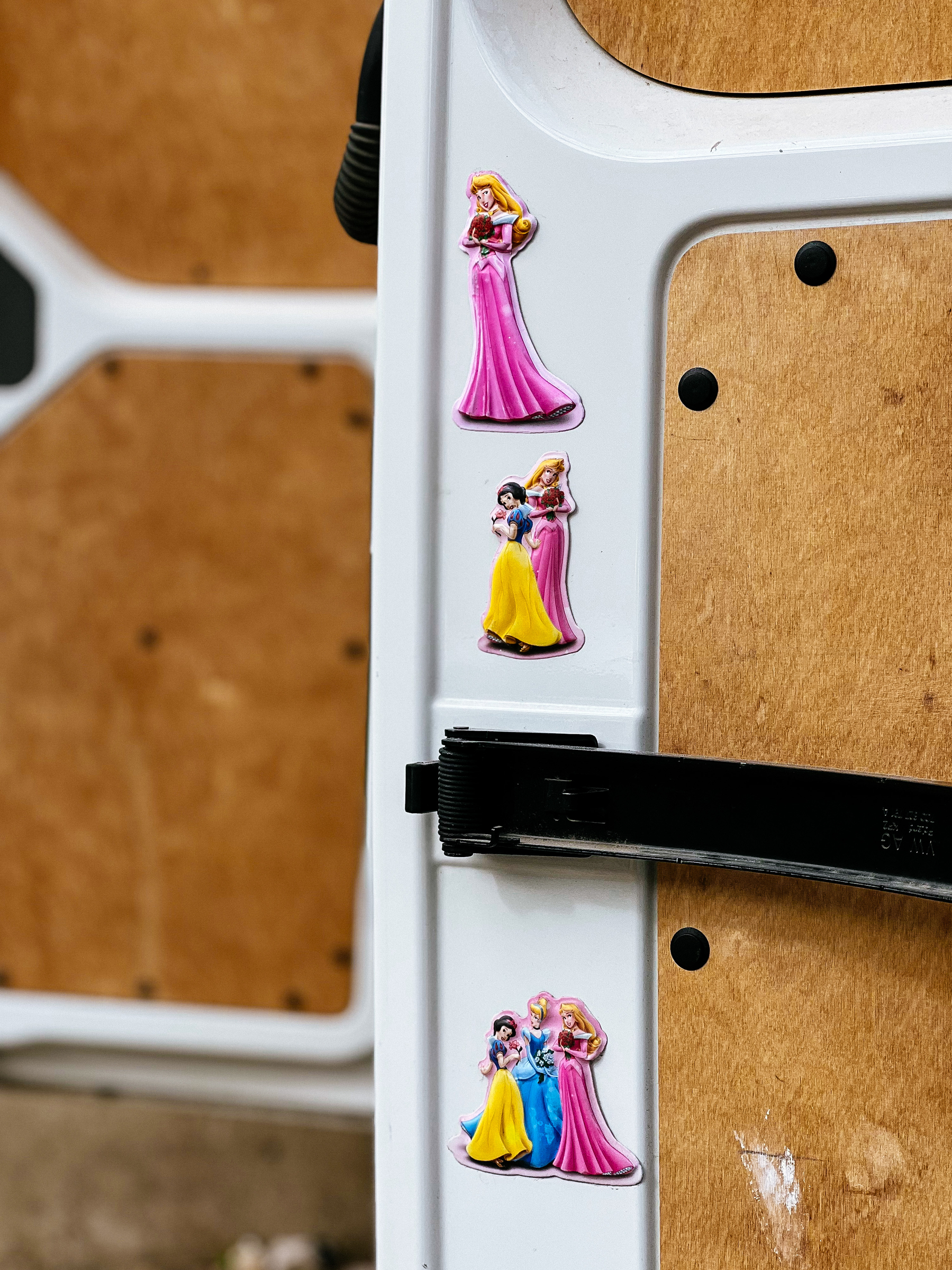 Disney princesses stuck to a van’s door. 