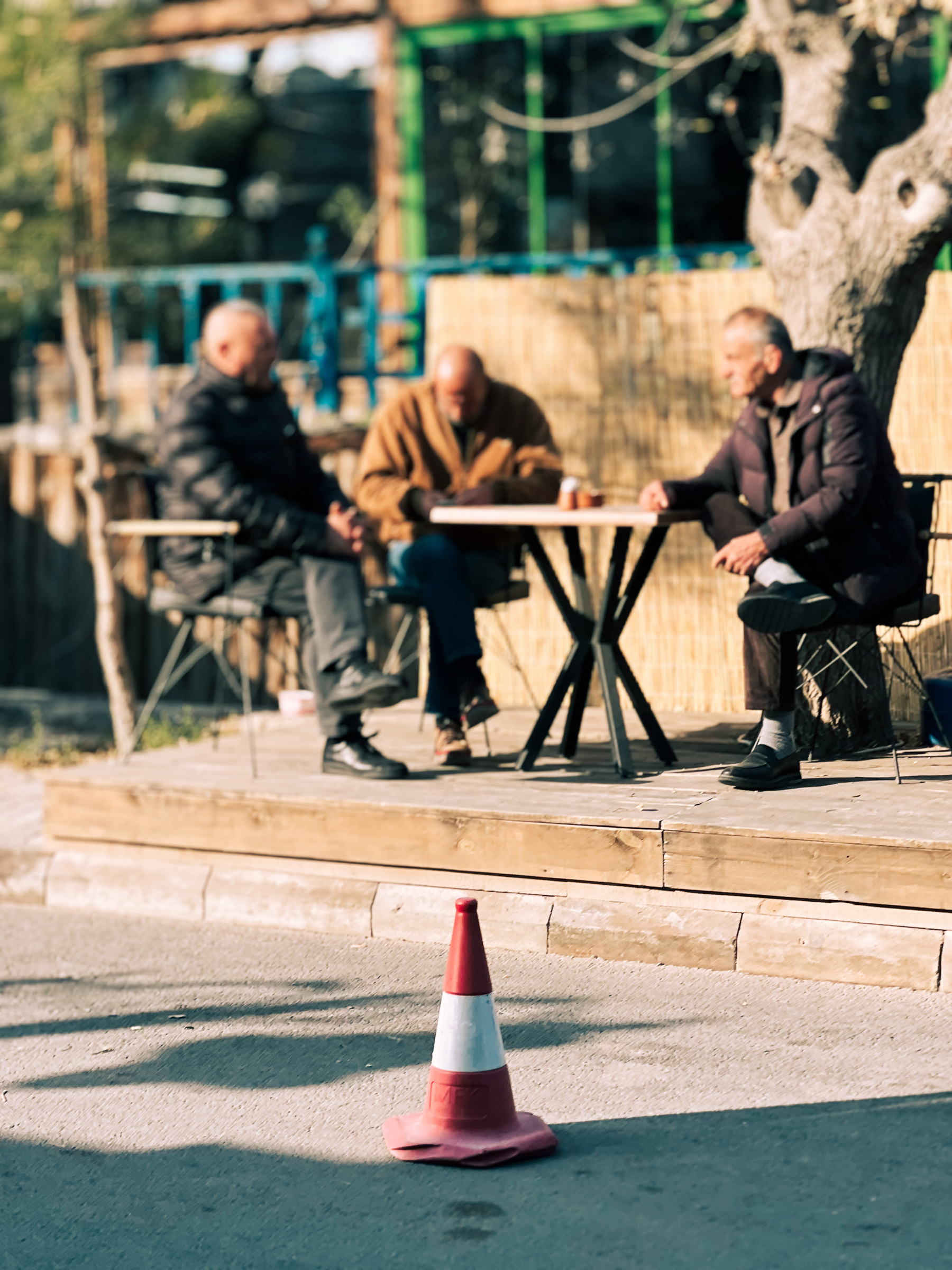 Old men sitting outside.