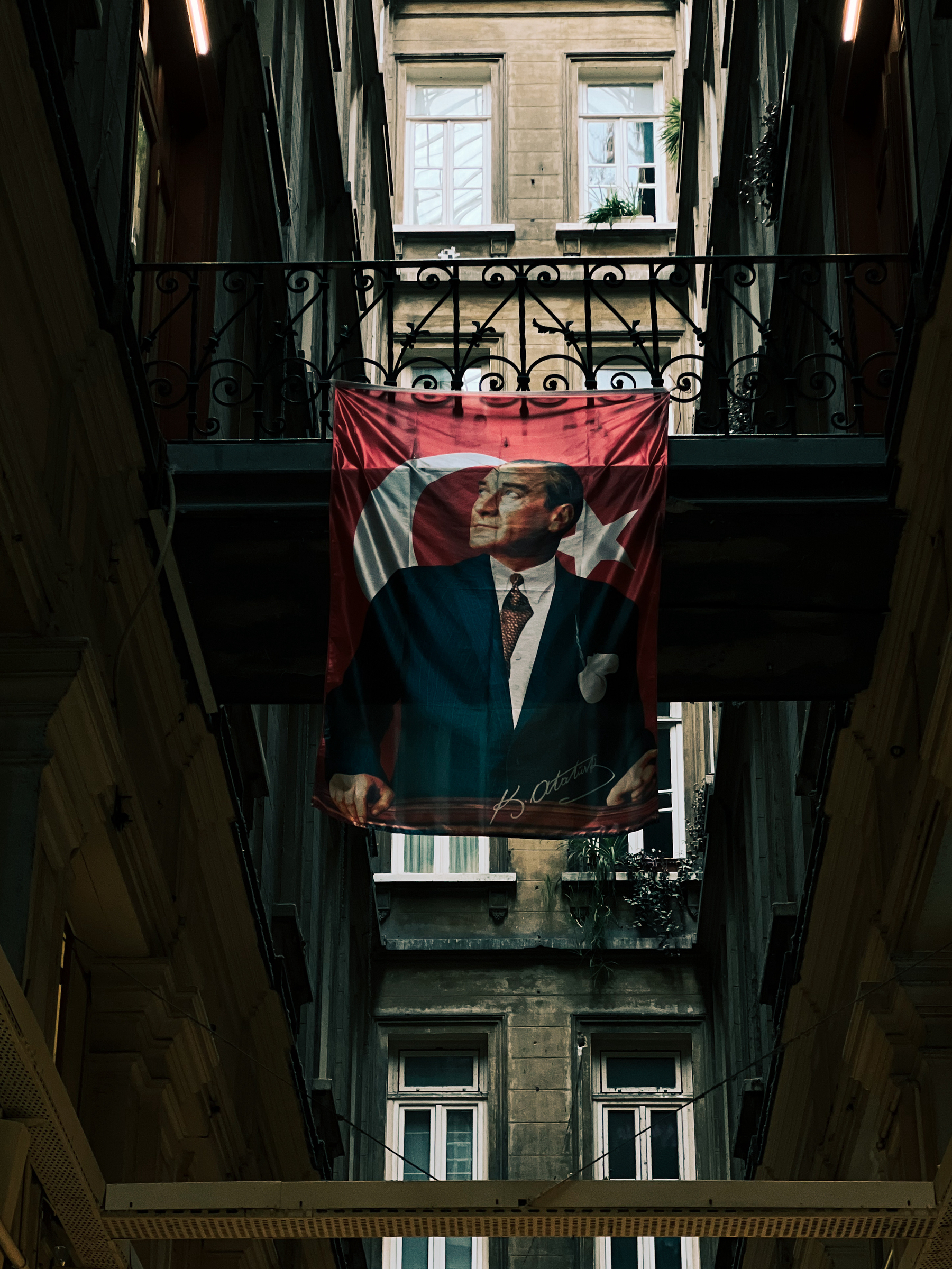 An Ataturk flag hangs inside a building. 