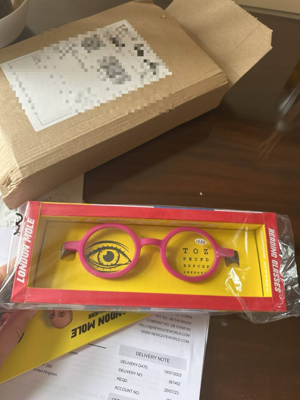 Pink glasses in a box. 