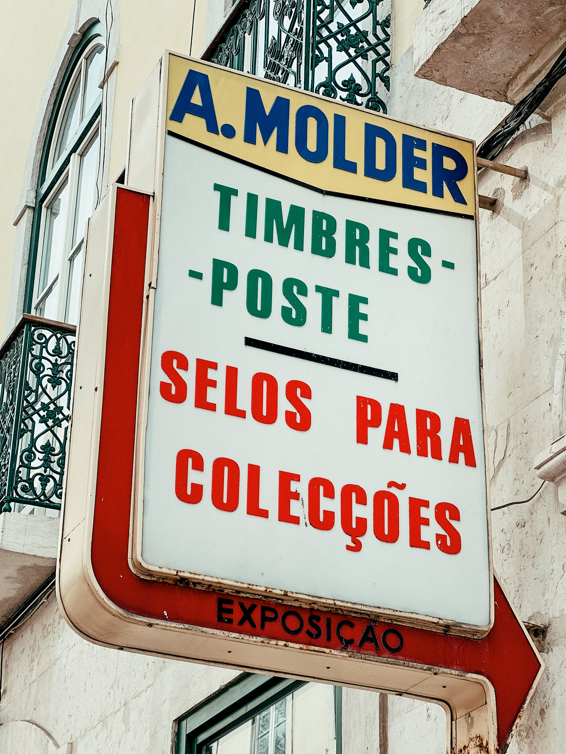 Vintage store sign, selling collectible stamps. 