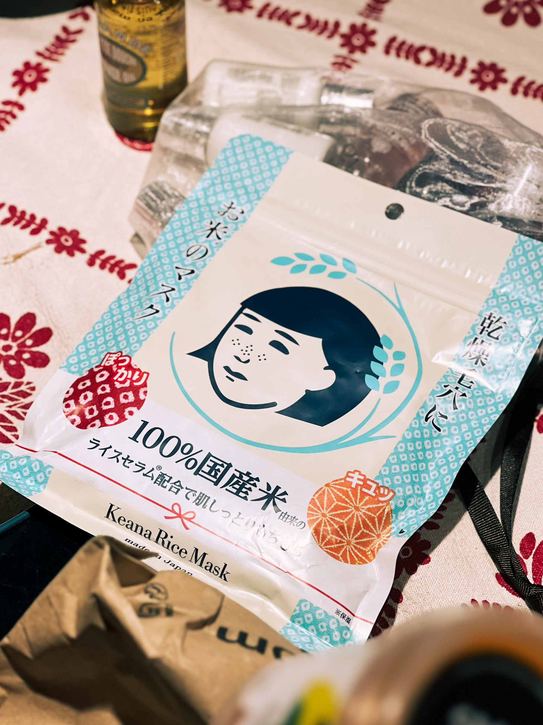 A package of Keana Rice Mask on a patterned cloth.