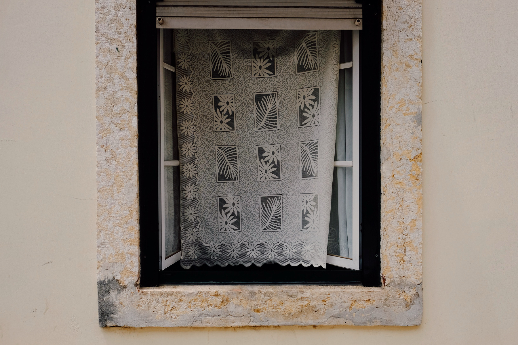 A window with a curtain.
