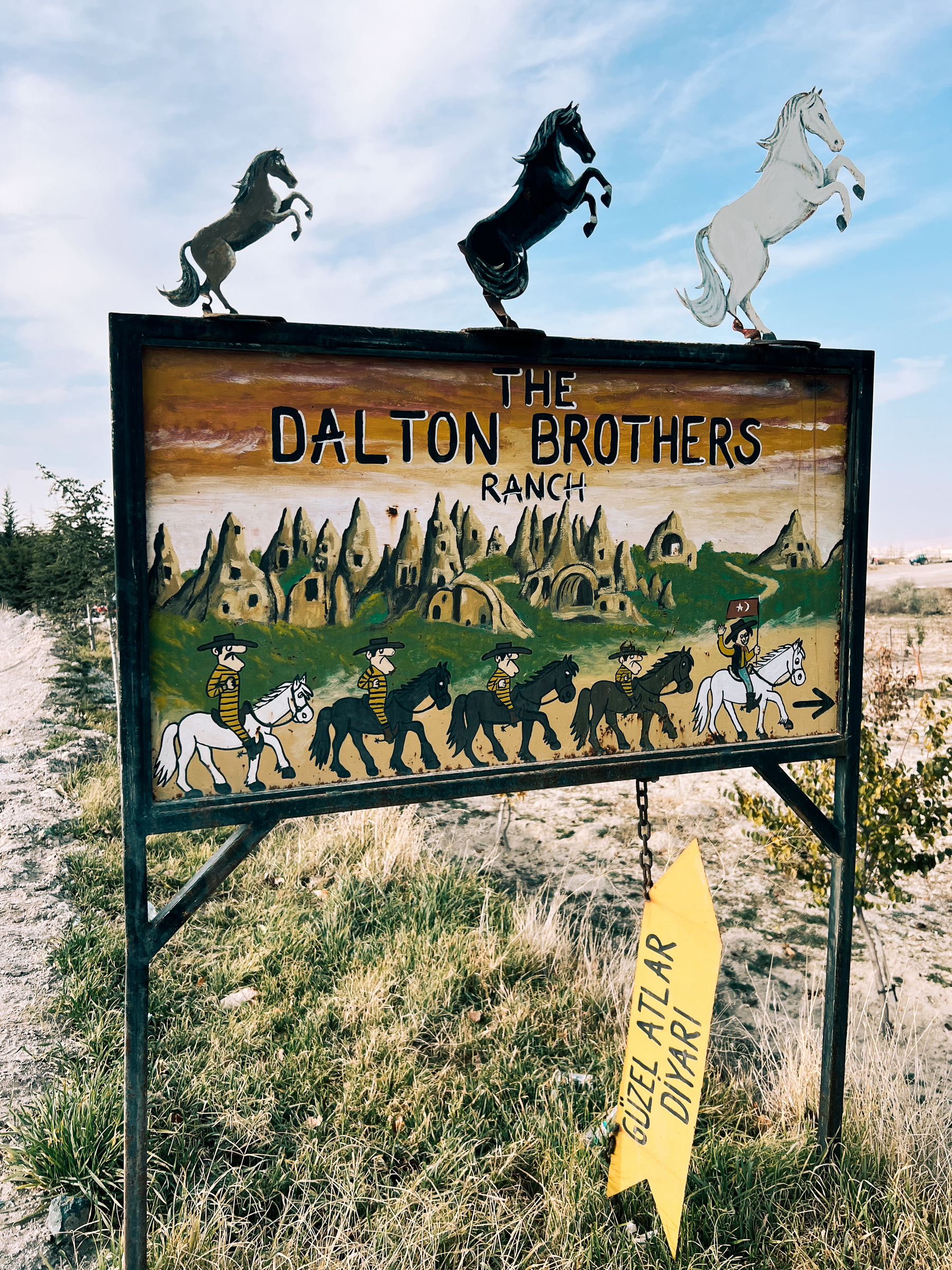 A hand drawn sign for “The Dalton Ranch”, with images of horses and the Dalton Brothers. 