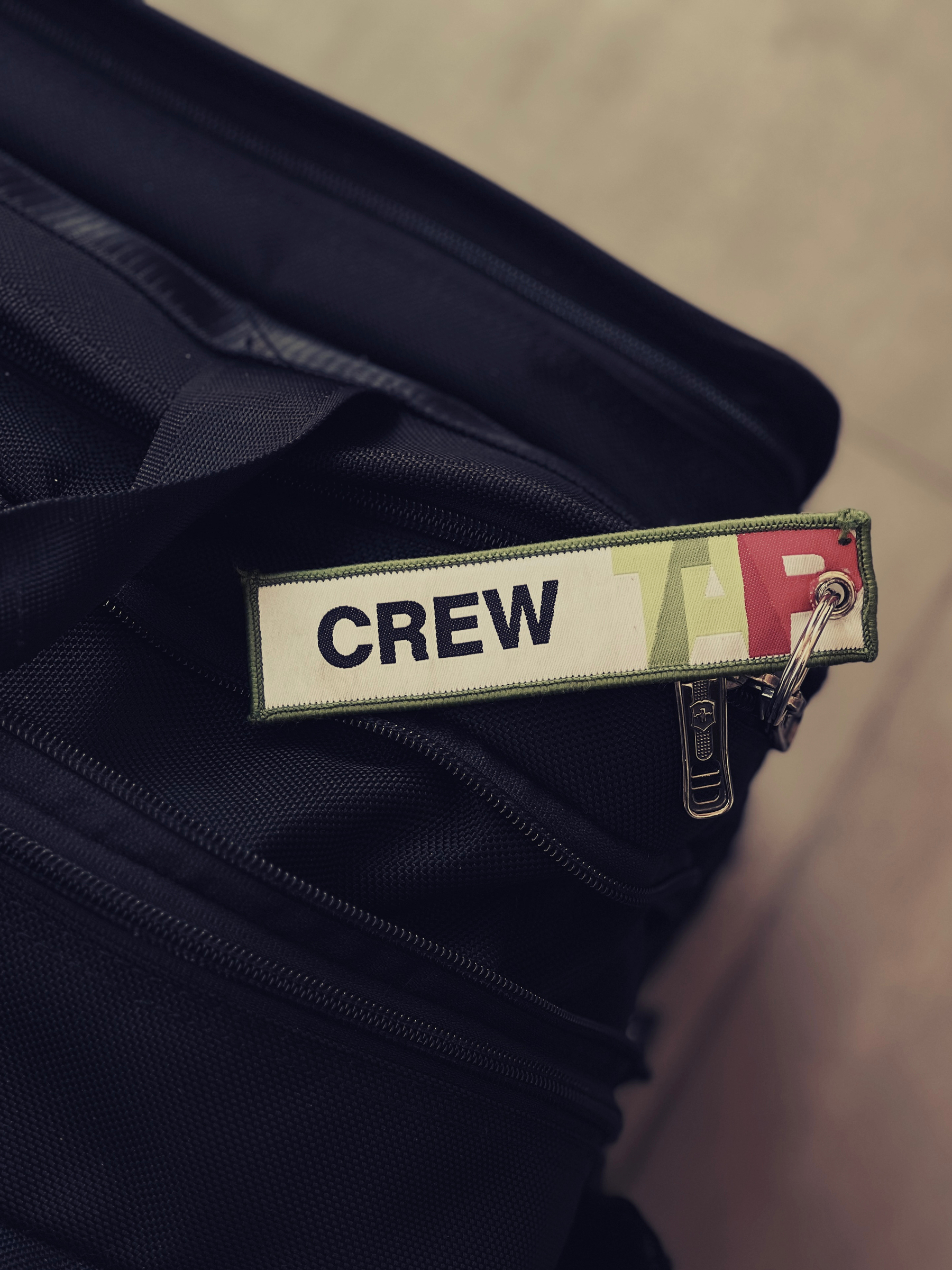 A bag with a “crew” tag for TAP. 
