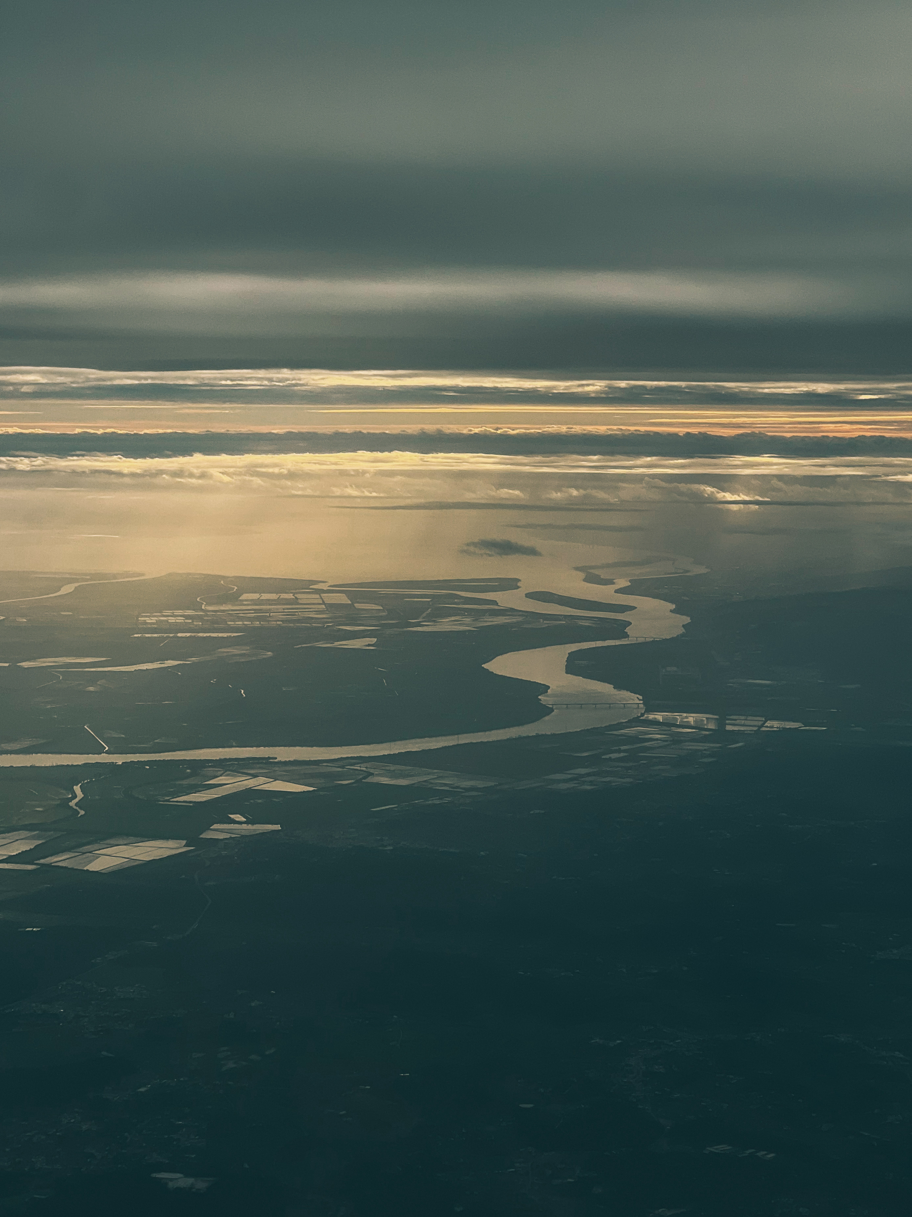 Shot from an airplane, a landscape with a river. 