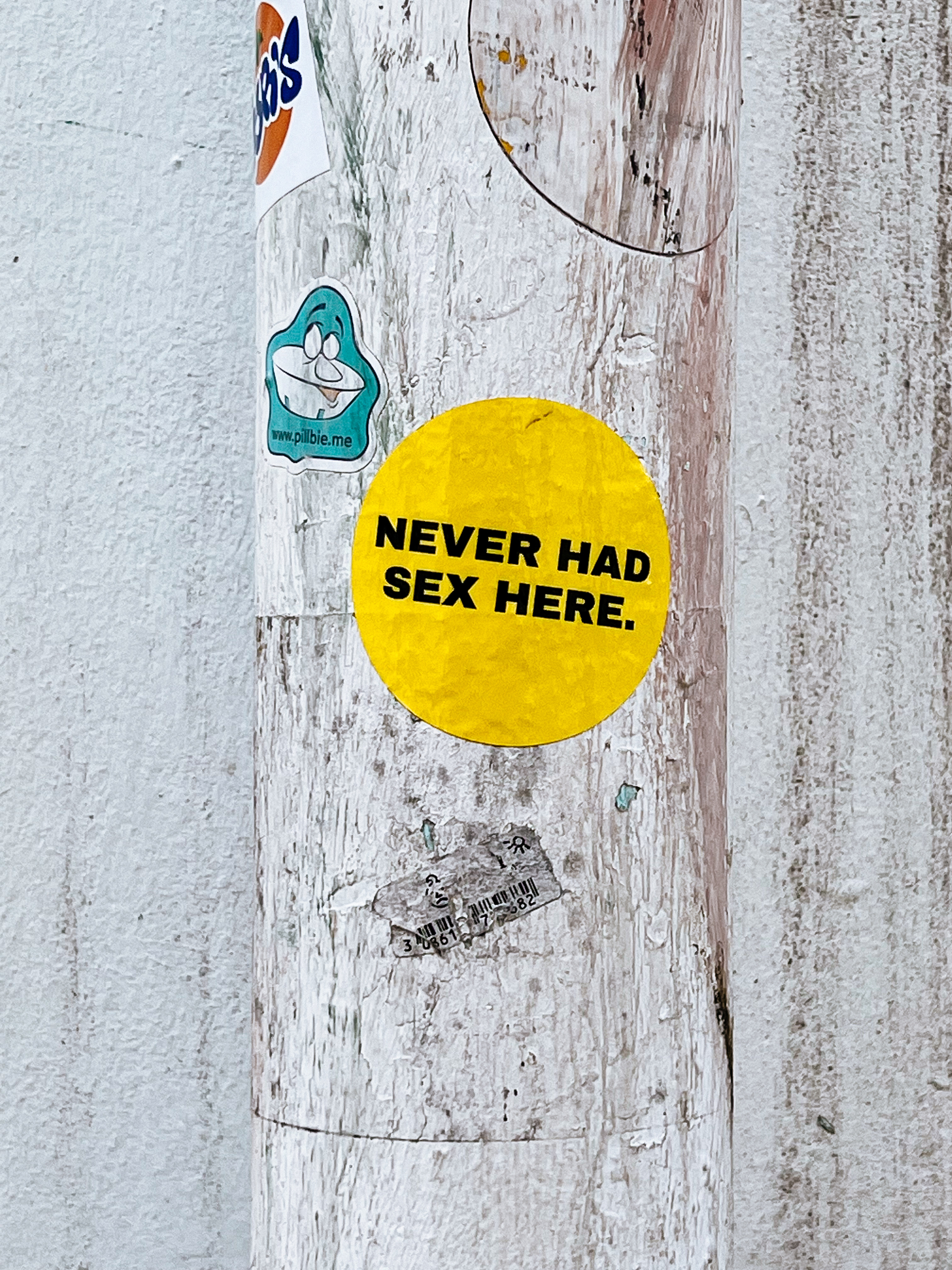 “Never had sex here”, on a circular yellow sticker. 