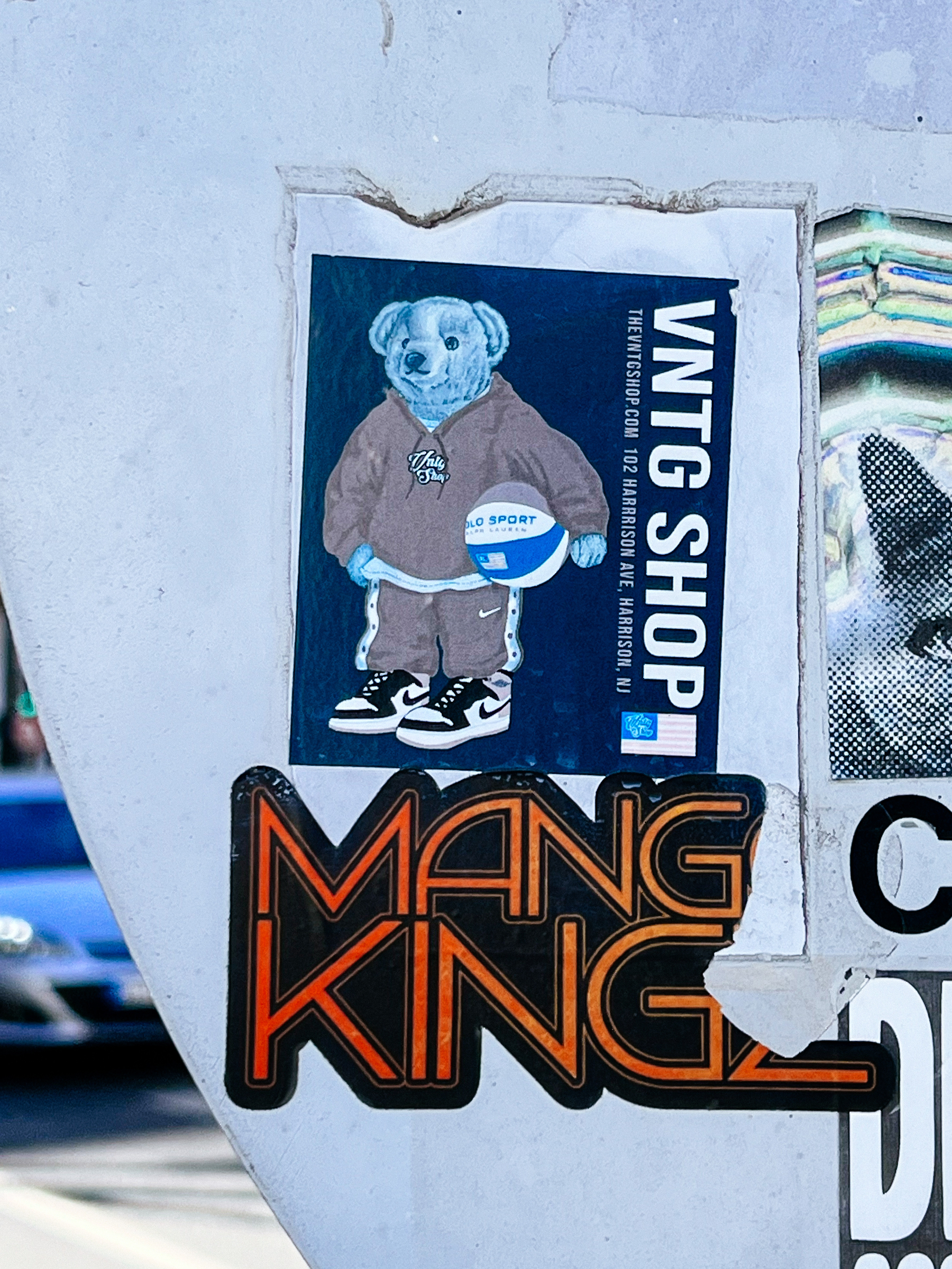 Sticker of a koala wearing a hoodie and sneakers, holding a basketball.