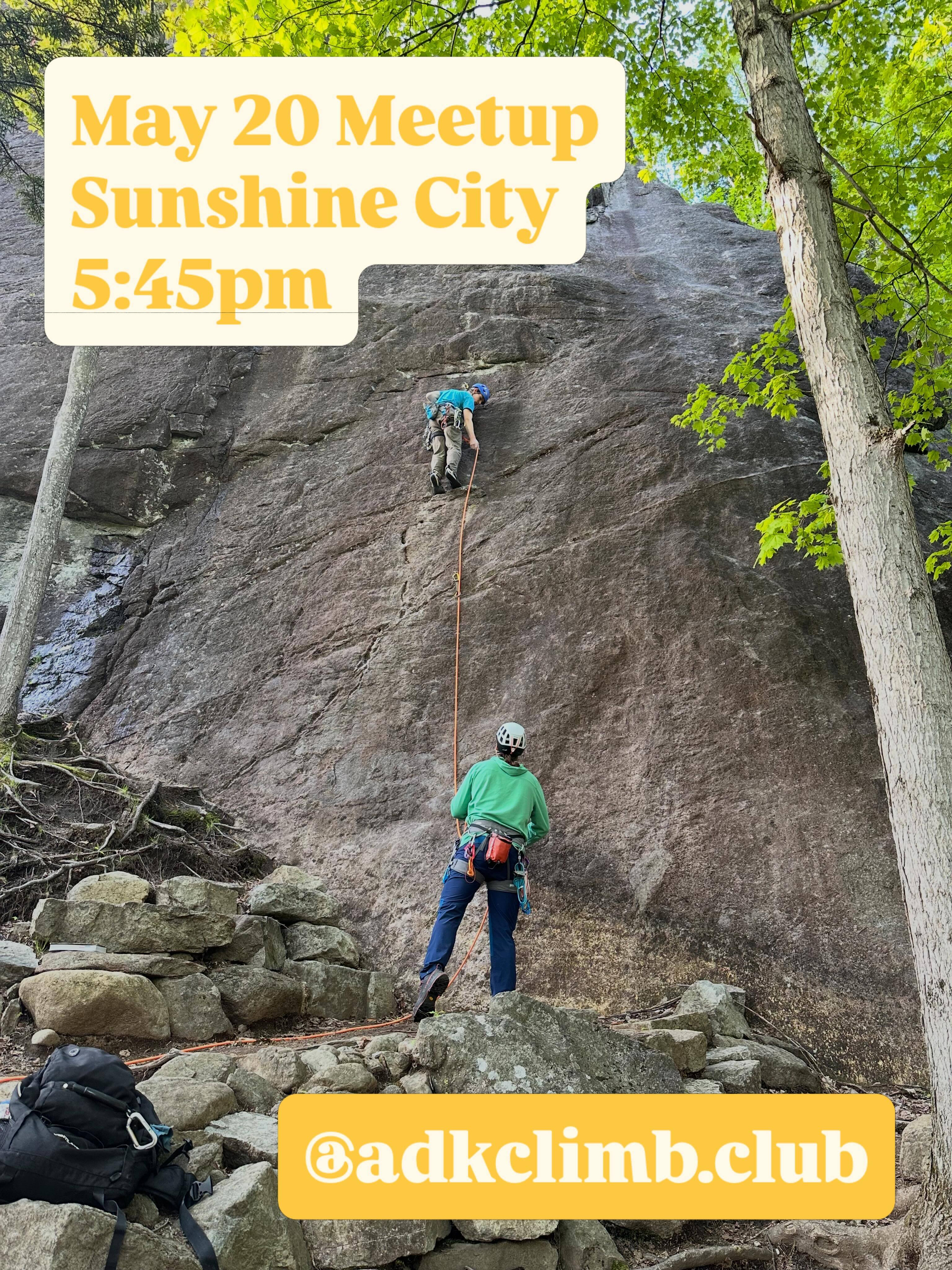Two rock climbers engage in an ascent on a steep rock face surrounded by trees and a stone base. Text reads May 20 Meetup Sunshine City 5:45pm at adkclimb.club