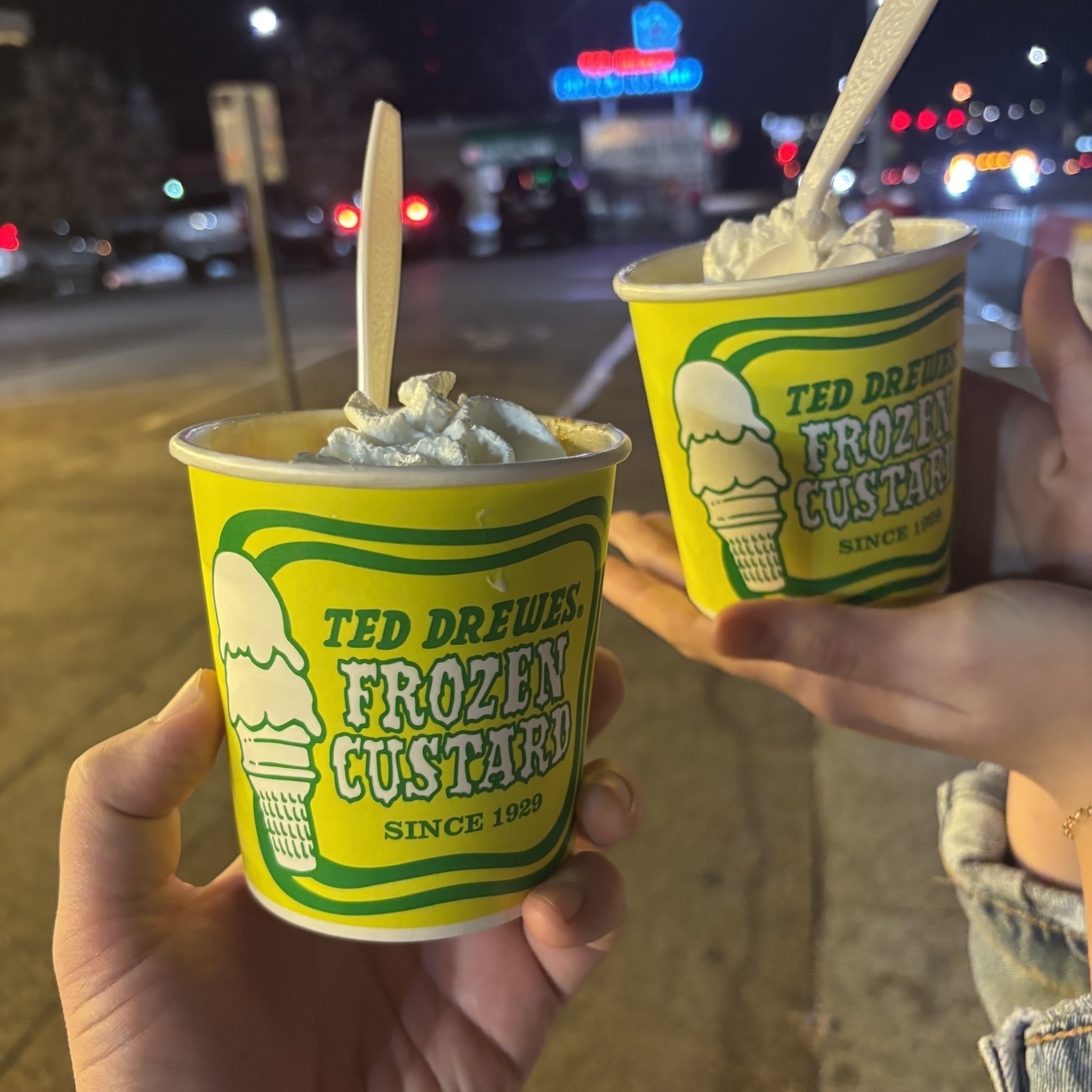 Two yellow cups that read "Ted Drewes Frozen Custard Since 1929" with spoons sticking out. A little whipped cream is visible on the top. These are sooooo good. 