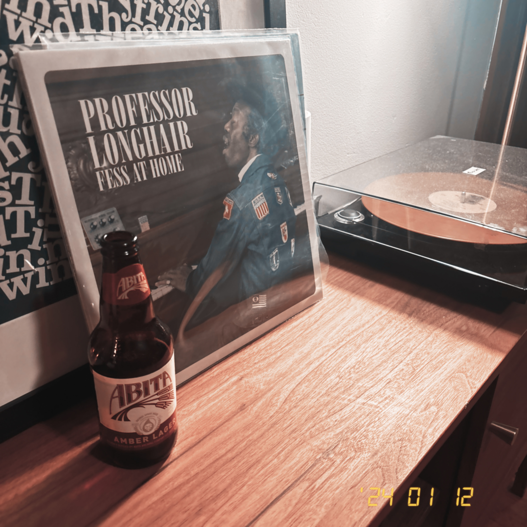 The album "Fess at Home" spinning on the record player with a strategically placed bottle of Anita Amber Lager. 