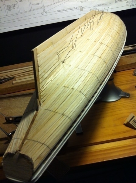 The hull of the Bluenose model ship being planked. 