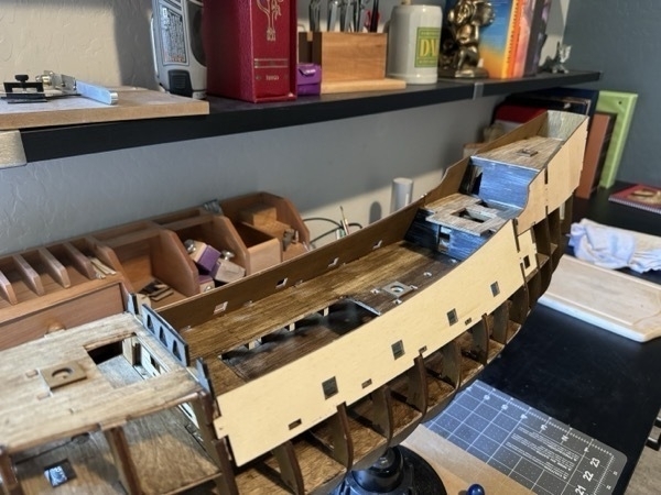View of the flying dutchman model ship with walls attached at mid-ships and at the stern. 