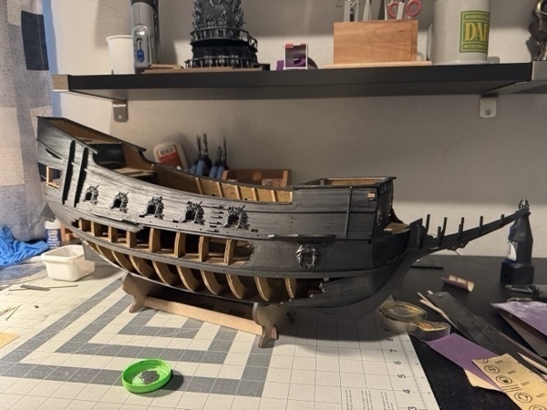 View of the flying dutchman model ship painted black. 