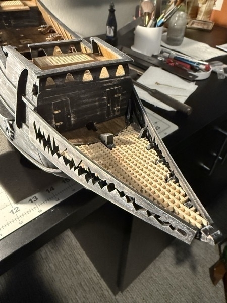 view of prow of flying dutchman model ship showing the "teeth" and the grating as the floor of the prow. 