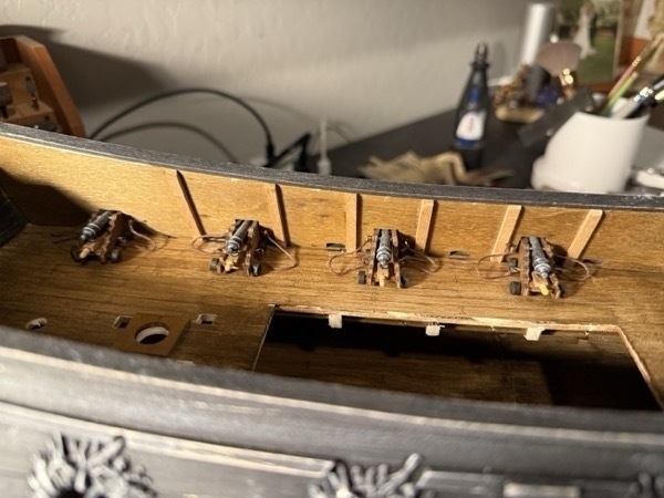 View of the cannons on the upper deck of the flying dutchman model ship. 