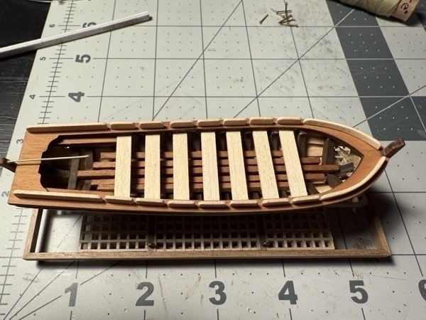 More of a top view of the skiff that sits inside the flying dutchman model ship. 