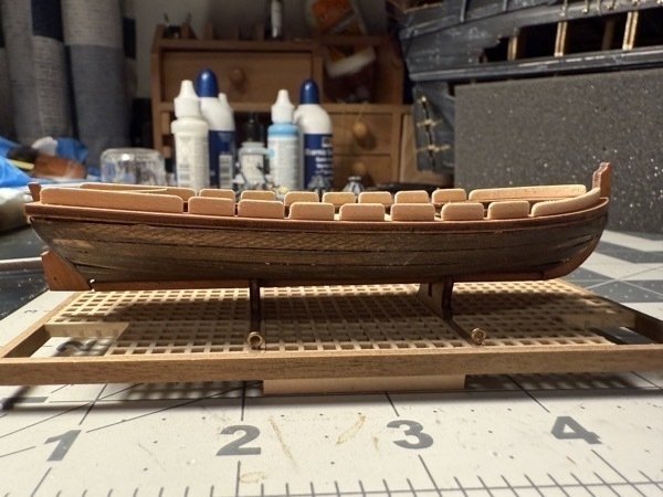 Side view of a small skiff that will sit inside the flying dutchman model ship. 