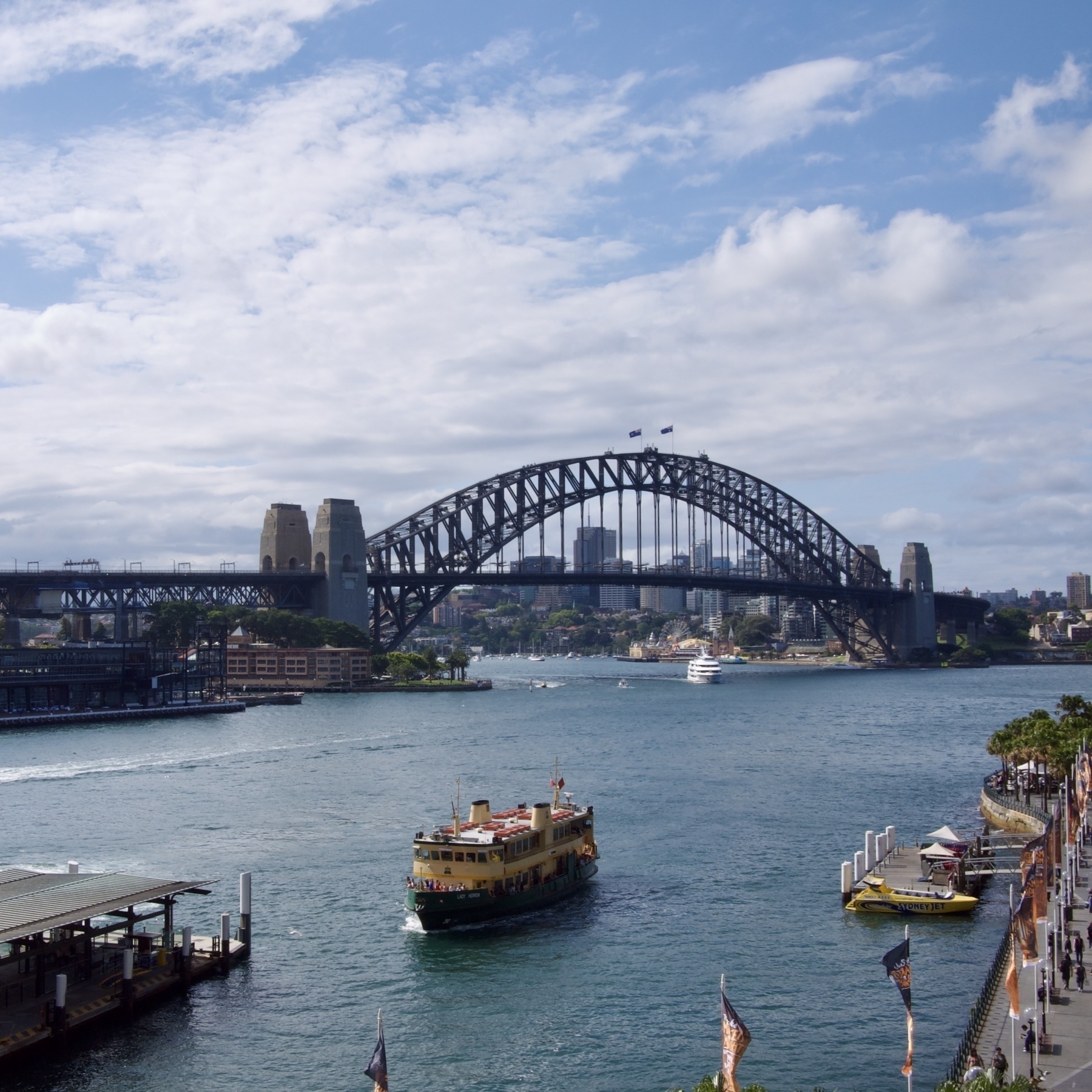 A boat in Circular Quay with the Sydney harbour bridge in the background.
