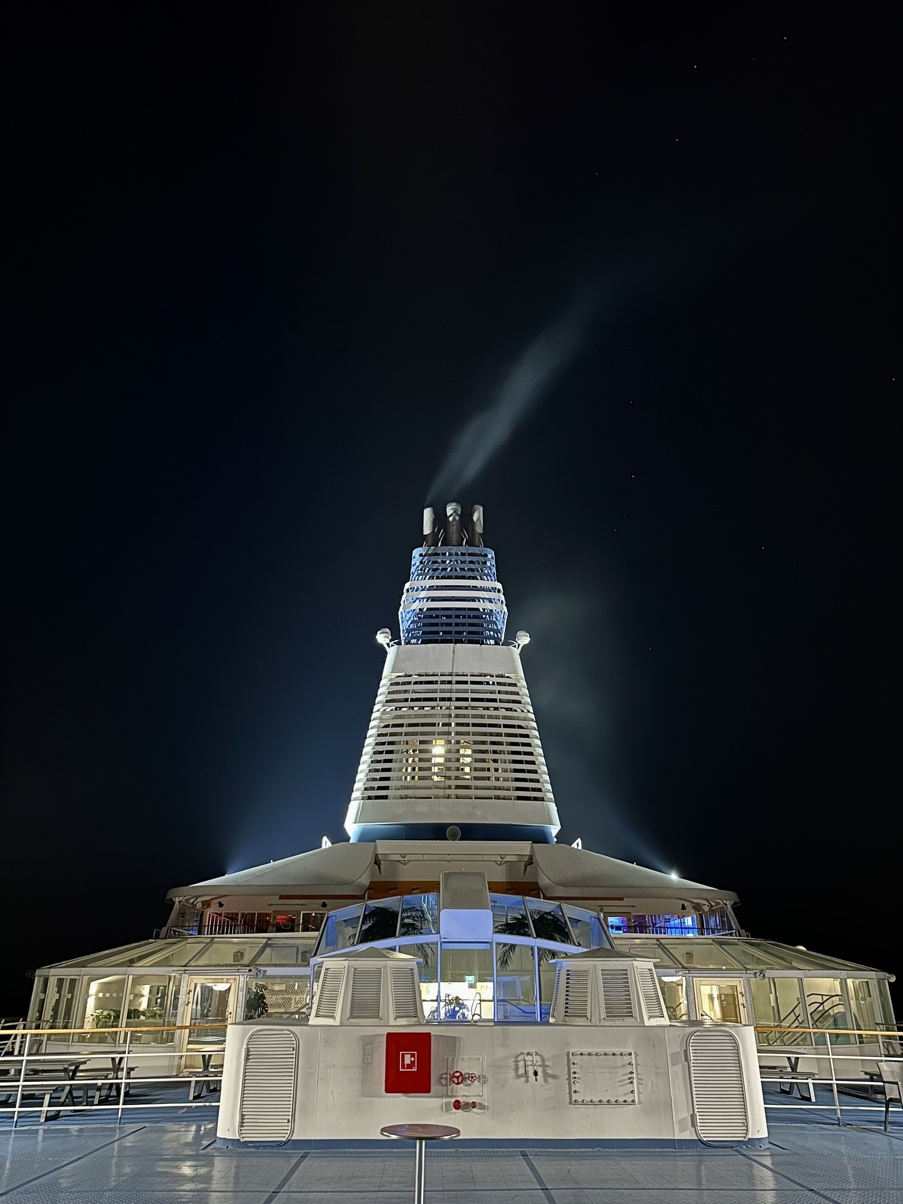 The funnel of a cruise ship at night.