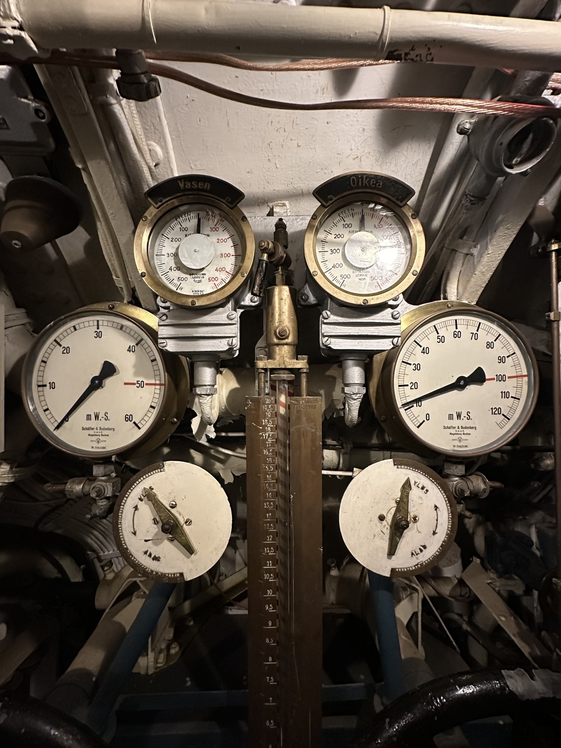 Six analog dials on a Finnish submarine.