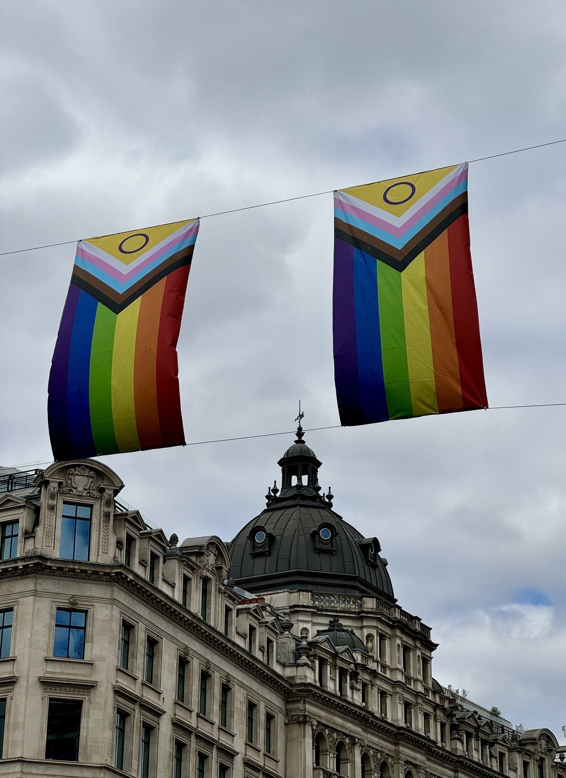 Two pride flags flying over Regent Street.