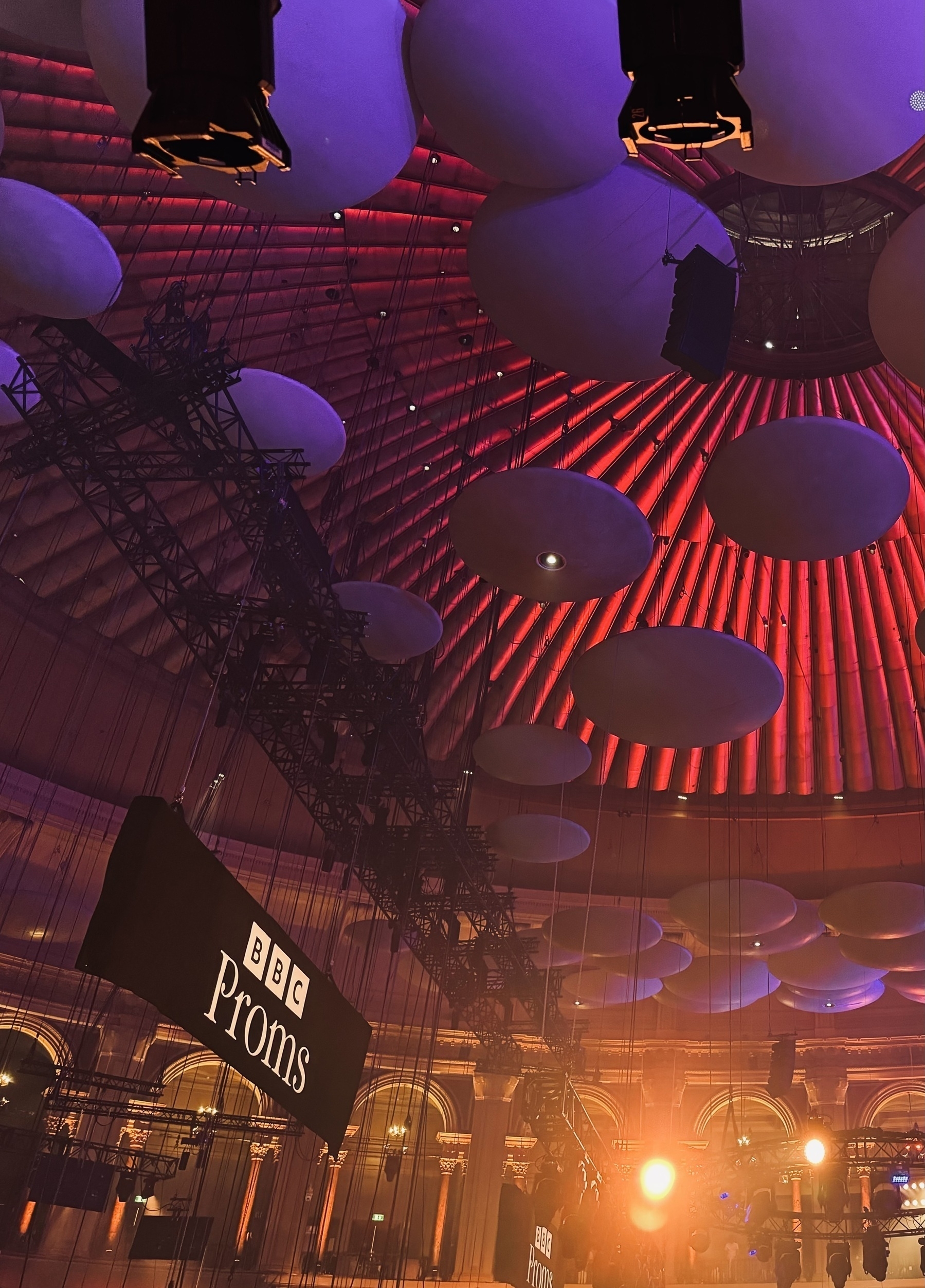 The ceiling of the Royal Albert Hall with a BBC Proms banner hanging from it.