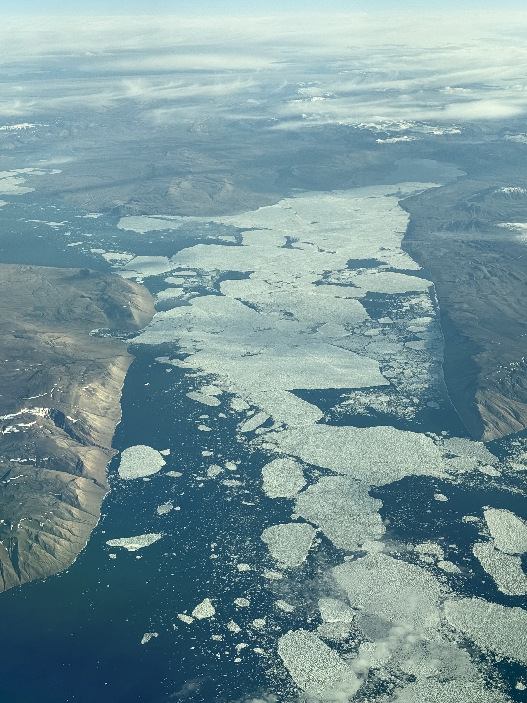 Large ice flows along a coastline.