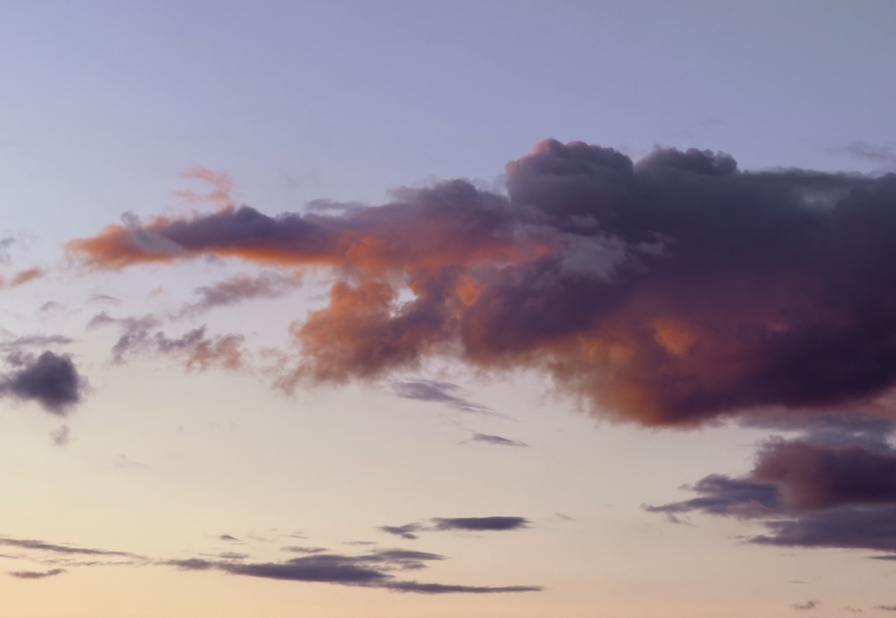 Clouds glowing red underneath at sunset.