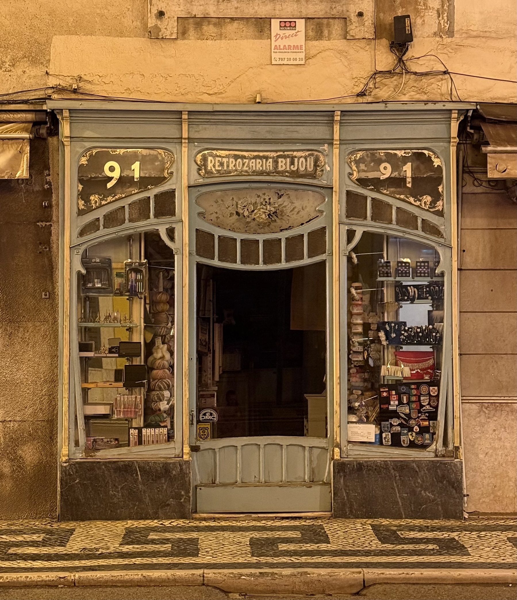 An ornate shopfront selling trinkets, in a warm light.