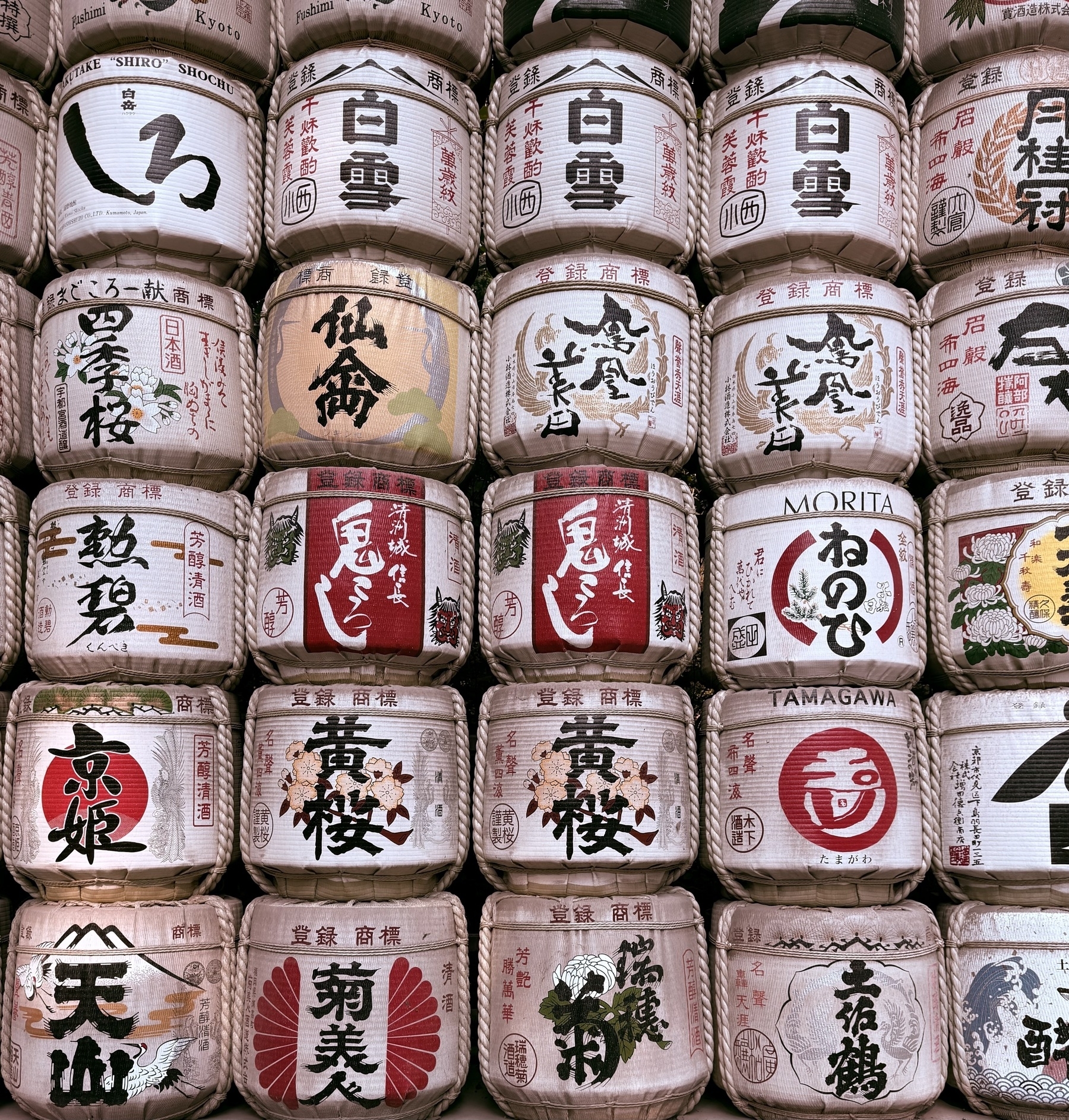A wall of sake barrels.