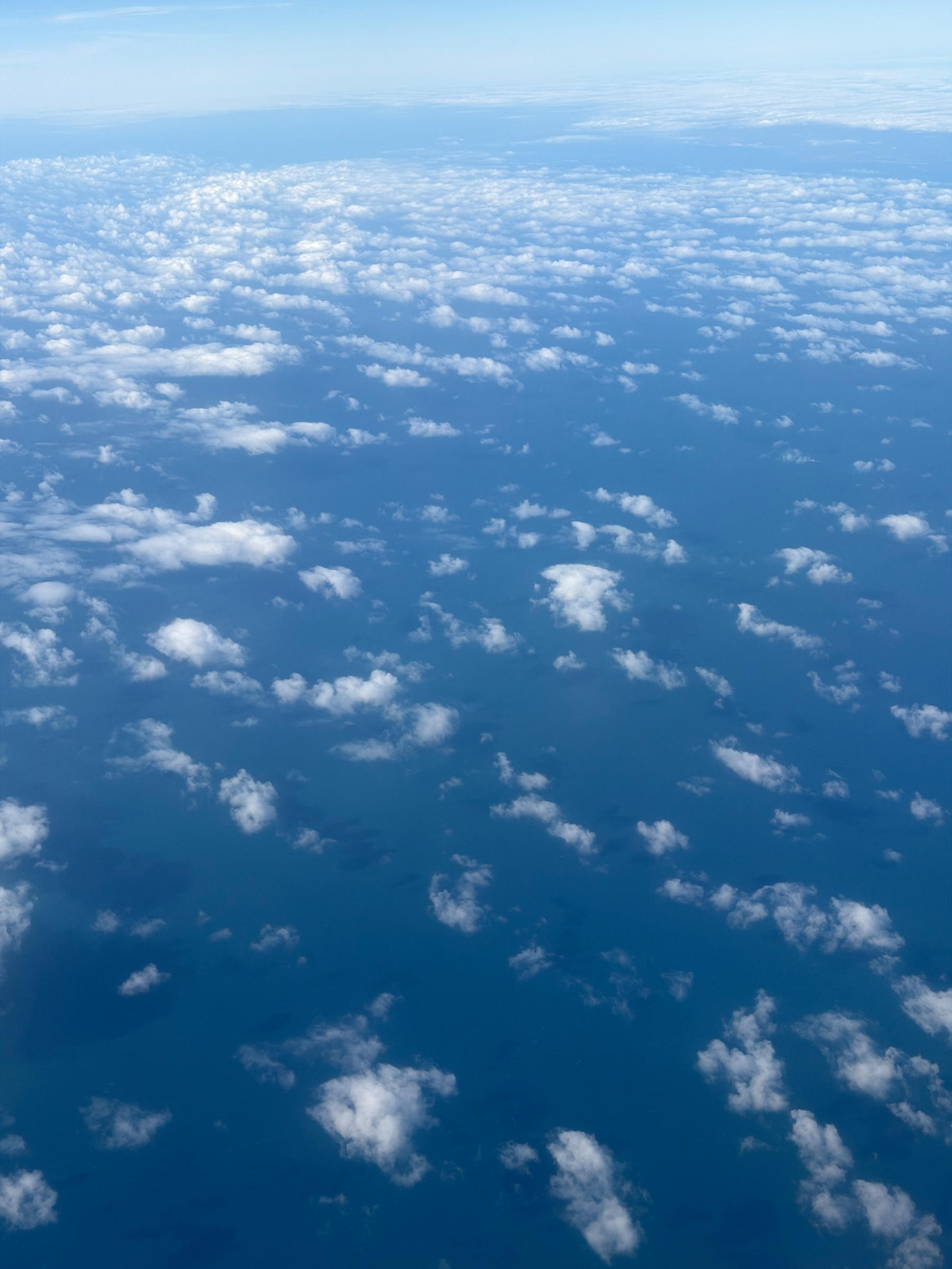 Fluffy white clouds over the sea.