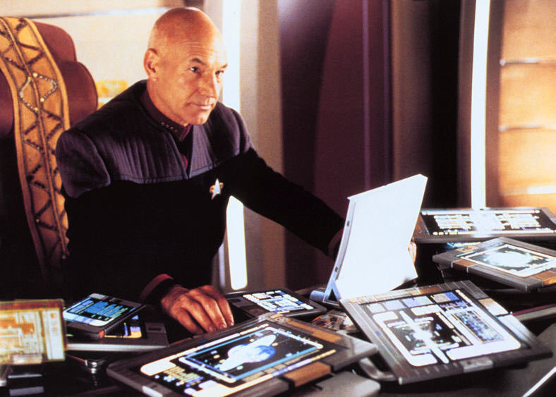 Captain Picard and desk full of tablet computers called PADDson Star Trek TNG