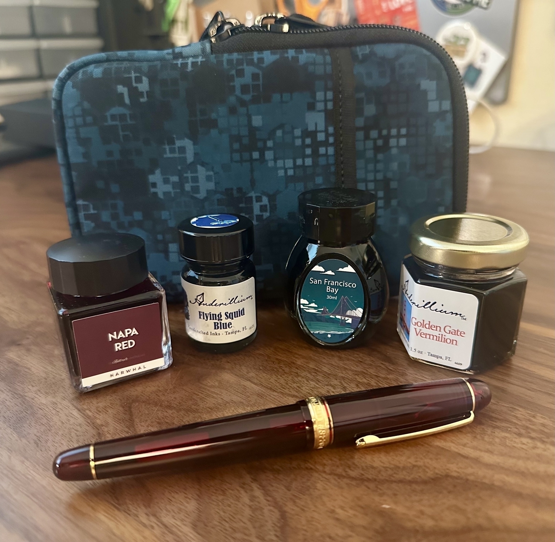 Nock Sinclair from Rickshaw Bags, Napa Red ink from The Pleasure of Writing, Flying Squid and Golden Gate Vermillion from Anderillium Inks, San Francisco Bay by Colorverse (the show-special ink), and a Platinum 3776 Century from Dromgoole’s. 