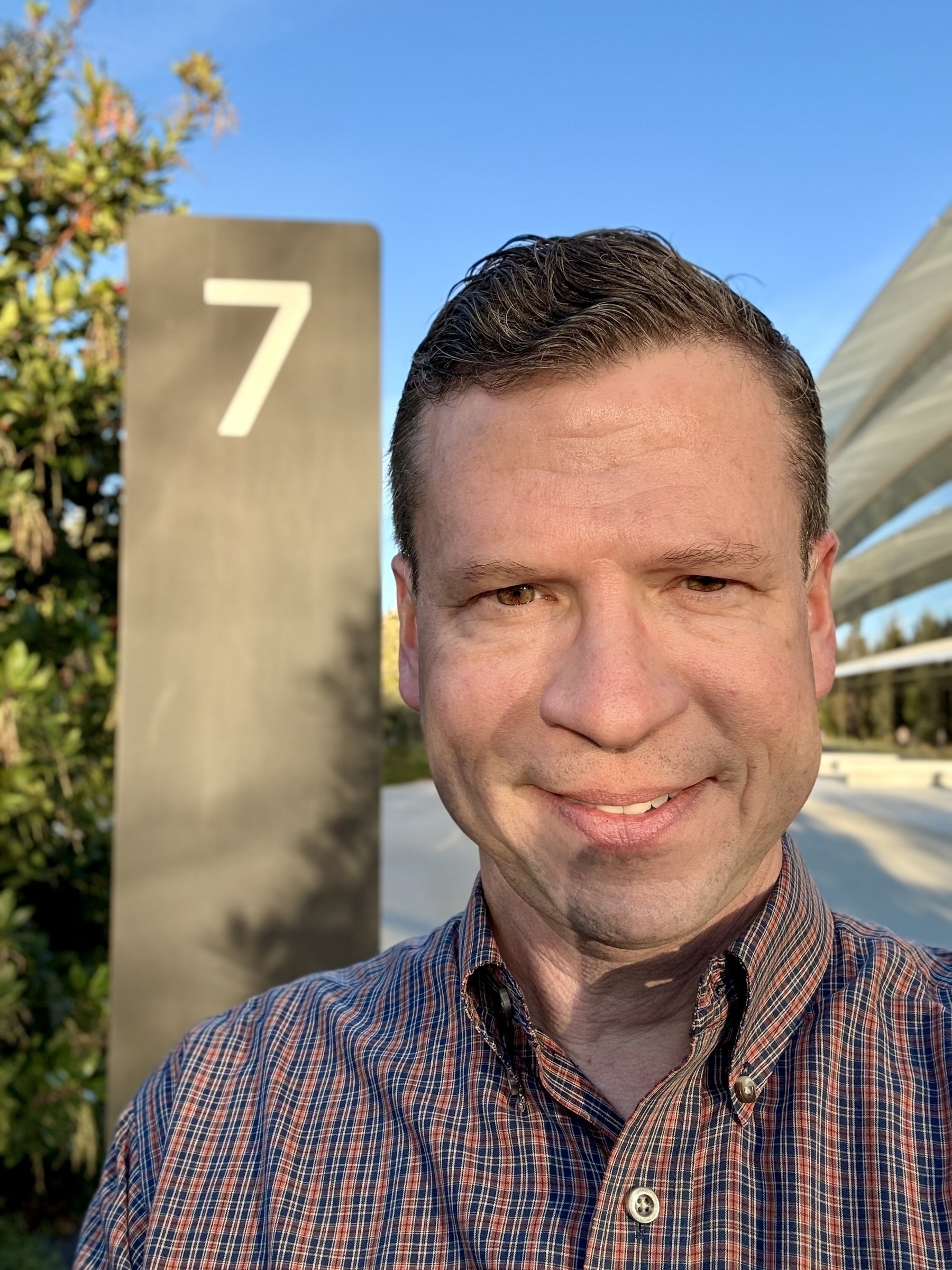 Selfie of me in front of the Section 7 sign at Apple Park, ring building in the background