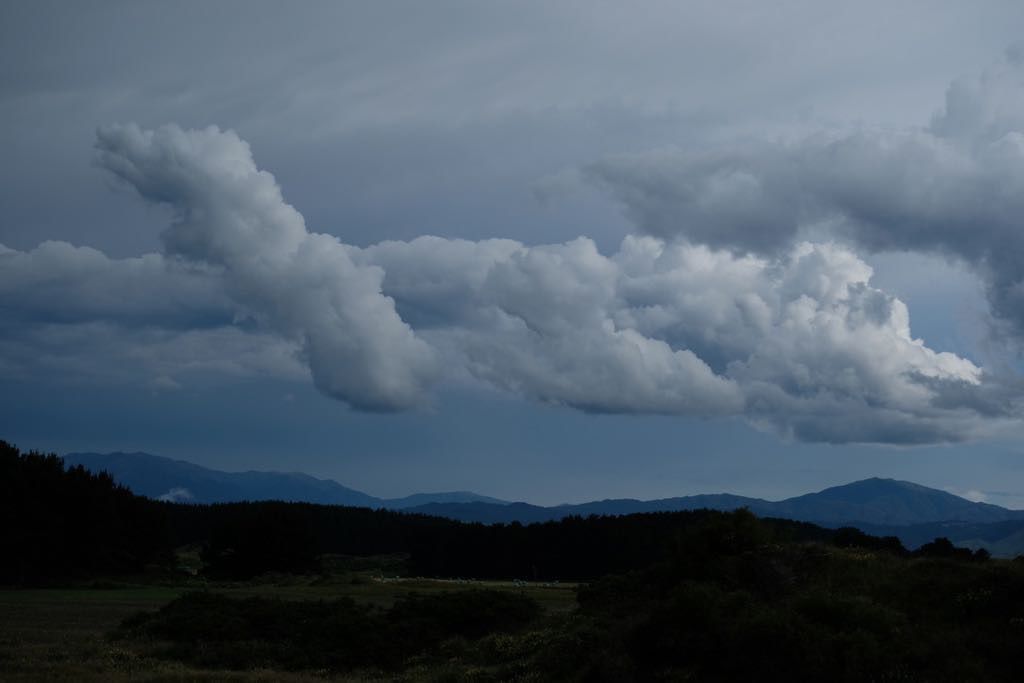 An interesting shape of fluffy clouds in a dark sky. 