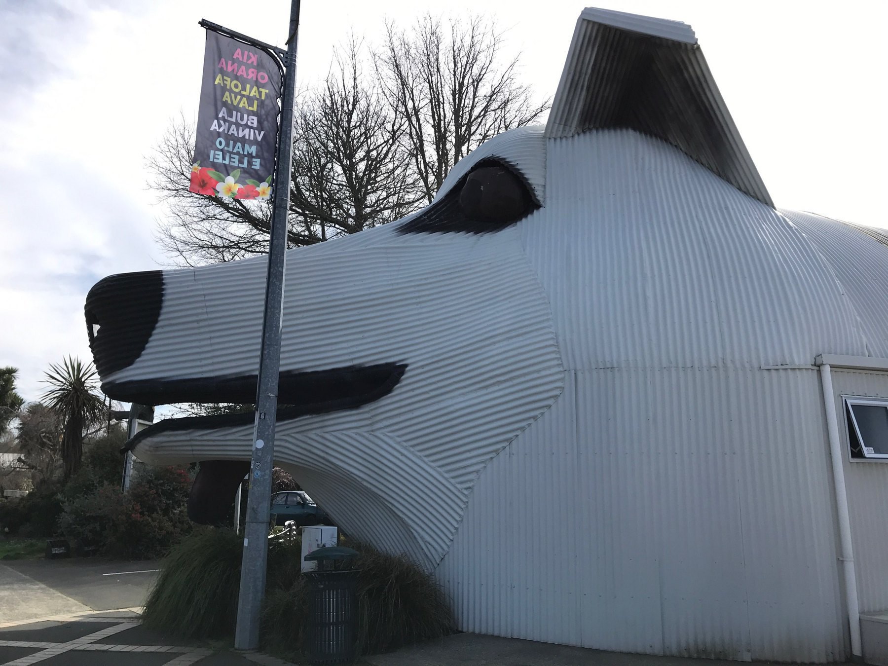 Corrugated iron building shaped like a dog. 