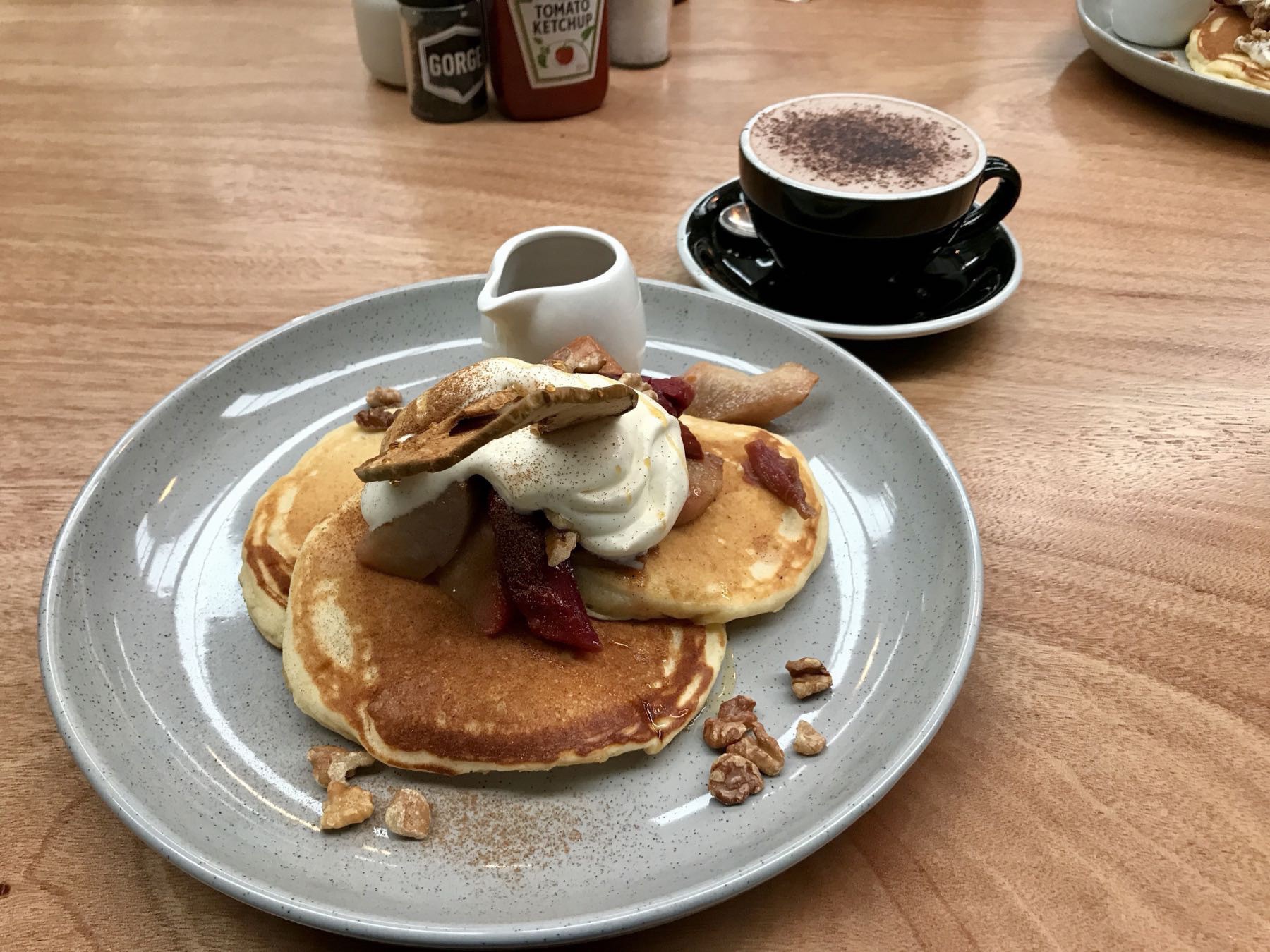 Hotcakes with rhubarb, pear, apple, cream, maple syrup. 